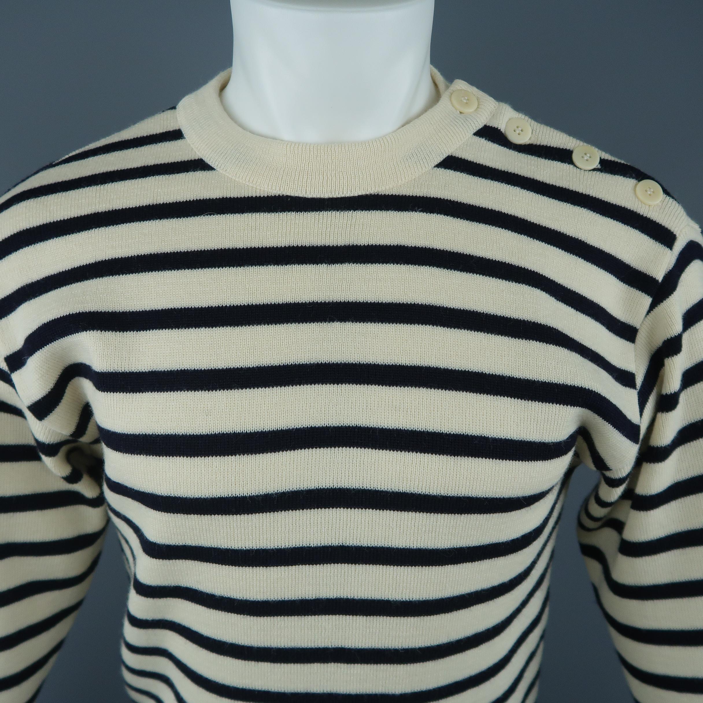 ARMOR-LUX French Sailor pullover sweater comes in creamy beige and deep navy blue striped wool knit with a ribbed button shoulder crewneck and cuffs. Made in Italy.
 
Excellent Pre-Owned Condition.
Marked: JP 2
 
Measurements:
 
Shoulder: 19