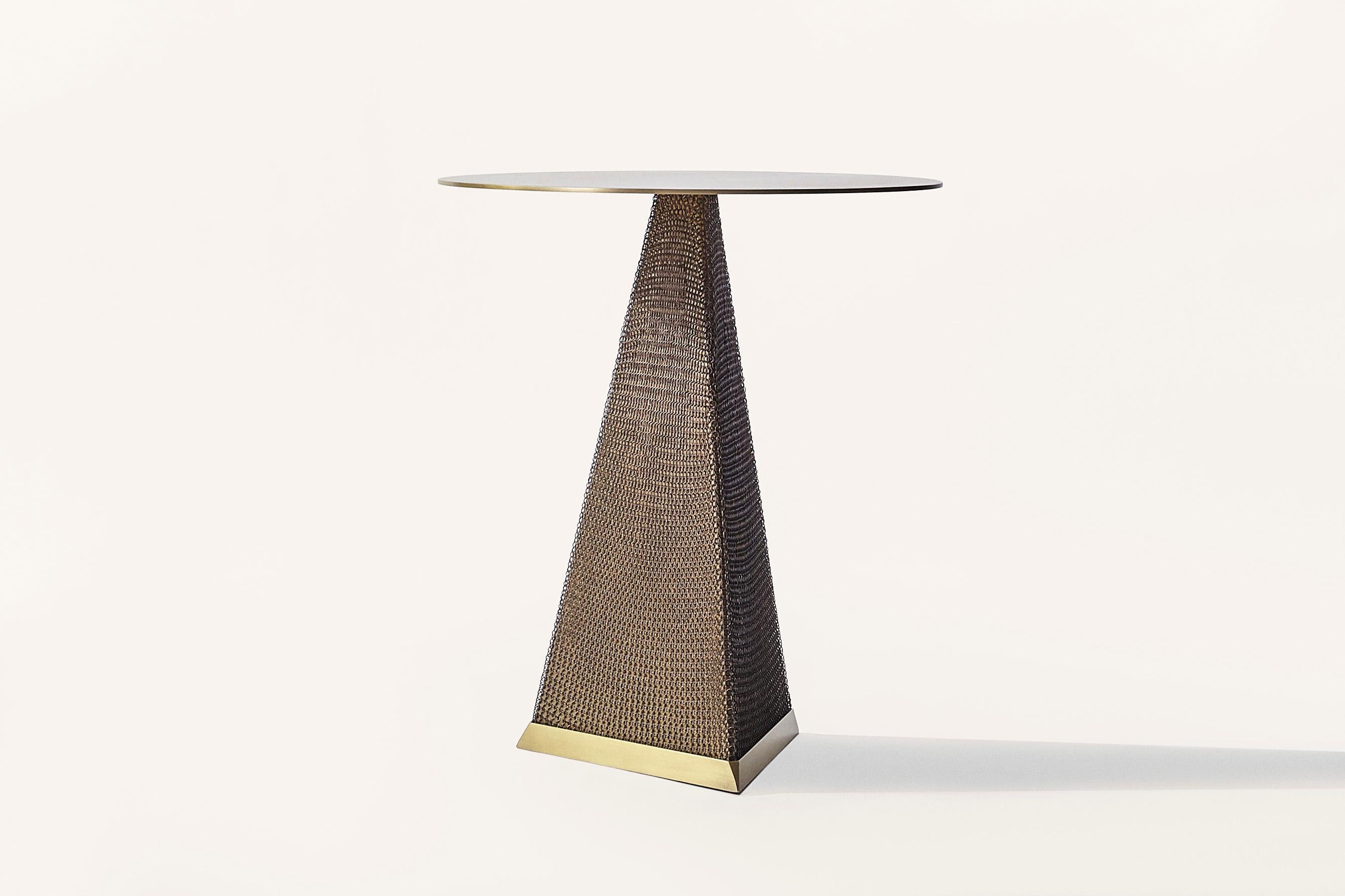 Part of the Armor collection and inspired by the intricate use of chainmail in Medieval armor, the Armor Side Table features a cold-rolled steel table cloaked with finished stainless steel chainmail. This table is available with a triangle or