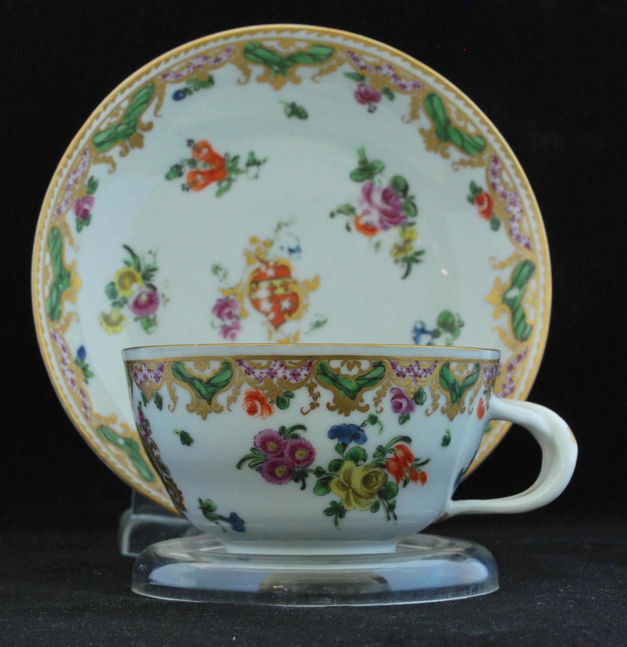 A Rococo cup and saucer, elaborately decorated with the arms of Ludlow, for Daniel Ludlow of Campden.