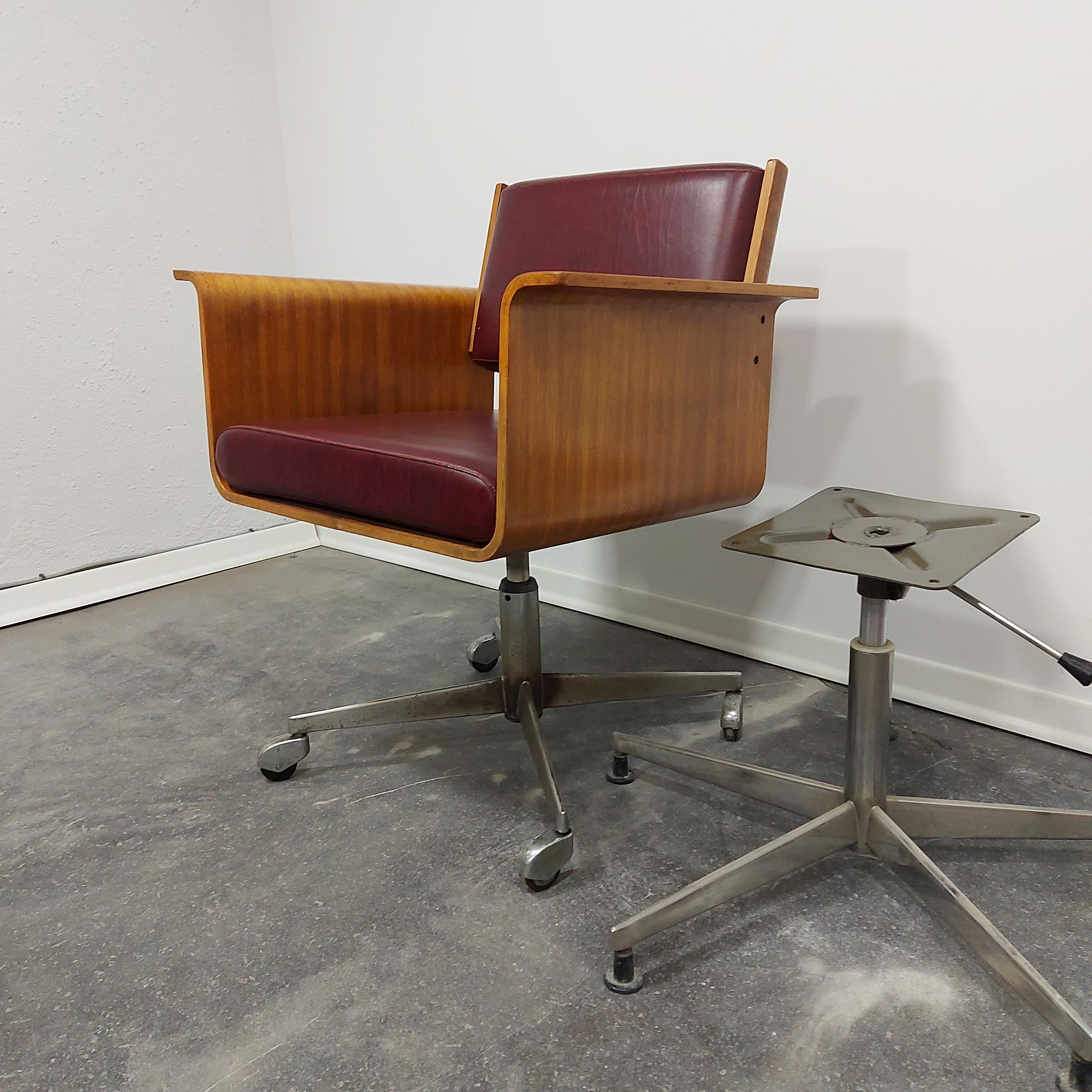 Vintage armrest lounge chair produced by STOL Kamnik (rare chair).

Period: 1970s 

Material: plywood, metal chromed base, leather.

Condition: very good vintage condition, some signs of use.

The hight can be adjusted but it does not work - on
