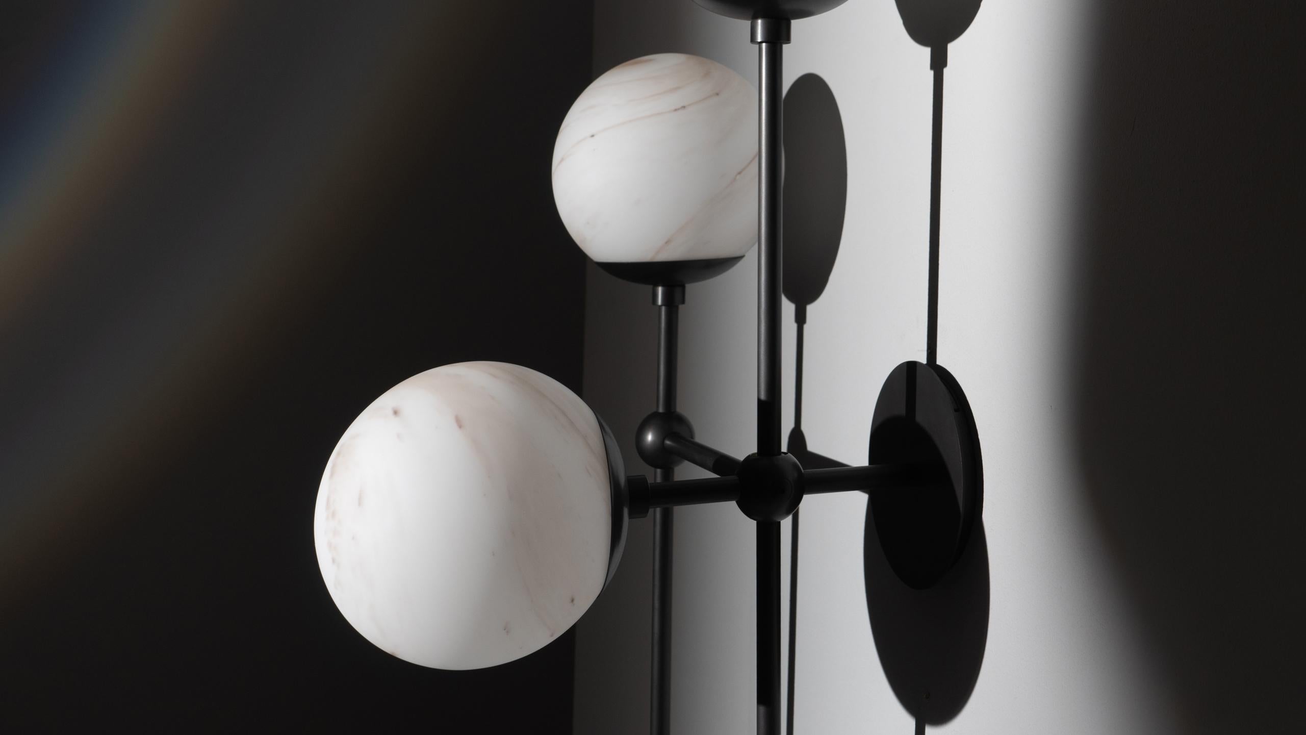 Armstrong 4L

Gravity-defying playfulness requires technical precision. Suggestive minimalism of connective nodes creates a grid-like metal structure-- punctuated by four glass globes.

Available in our three signature finishes: Lacquered