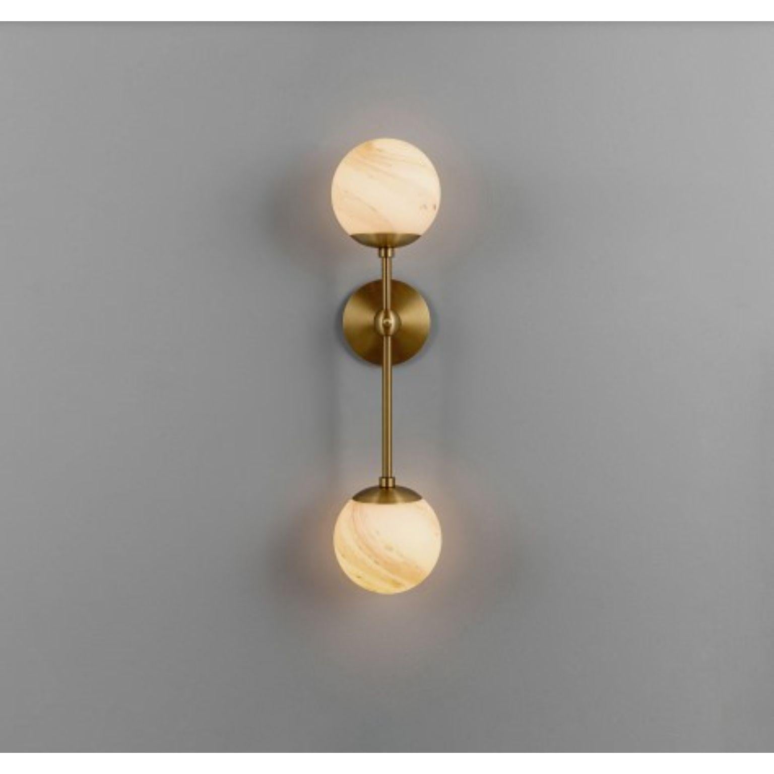 Armstrong Dual Wall Sconce by Schwung
Dimensions: H 63.7 x W 15 x D 16.9 cm
Materials: Brass, Opal glass
Weight: 2.6 kg

Finishes available: Black gunmetal, polished nickel, brass
Other sizes available.

 Schwung is a german word, and loosely