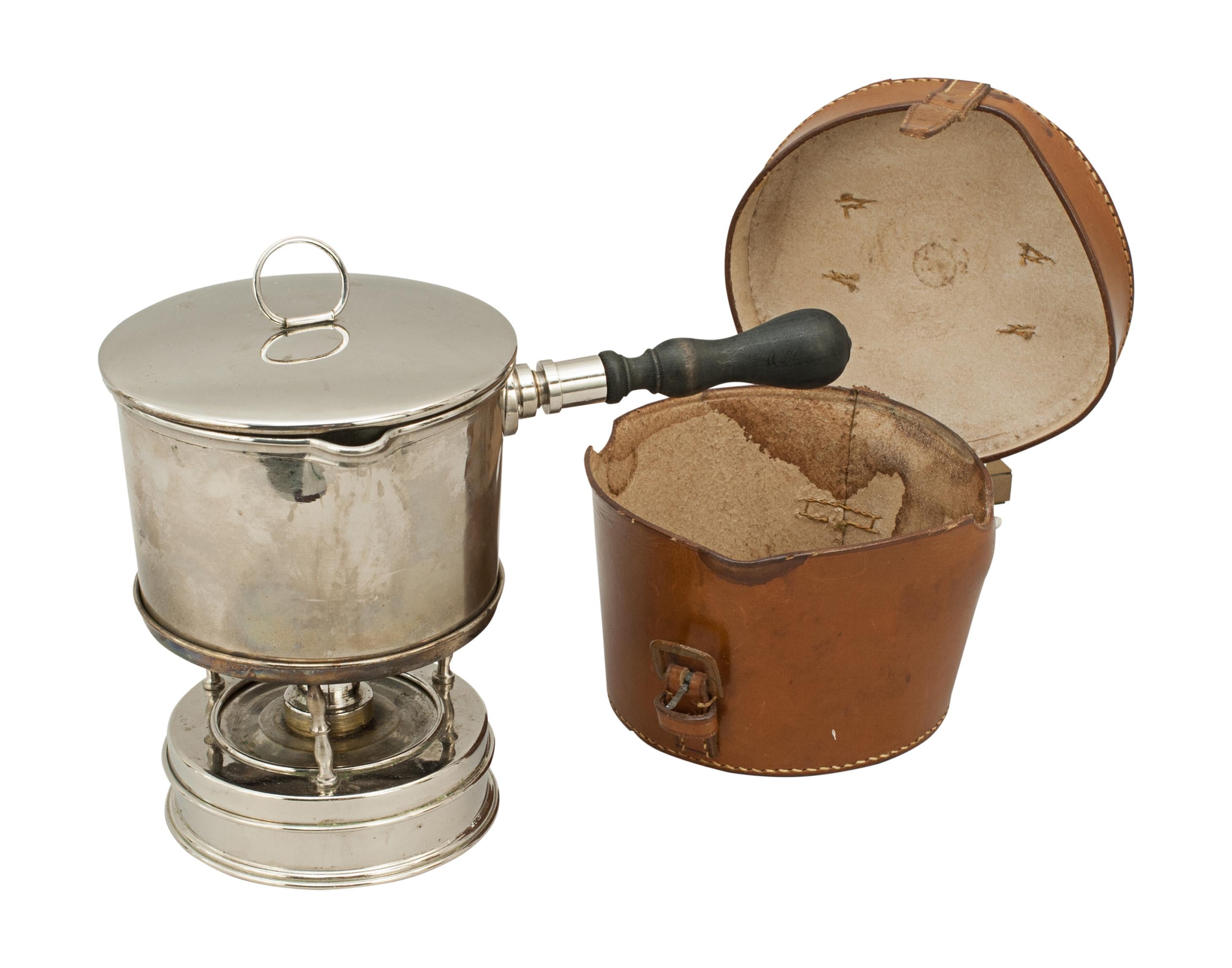 Army & Navy Campaign spirit stove with pan in original leather case.
An Army & Navy Cooperative Society Limited campaign/travelling spirit stove with sauce pan. The whole apparatus neatly packs into the leather travel case. The leather case is with