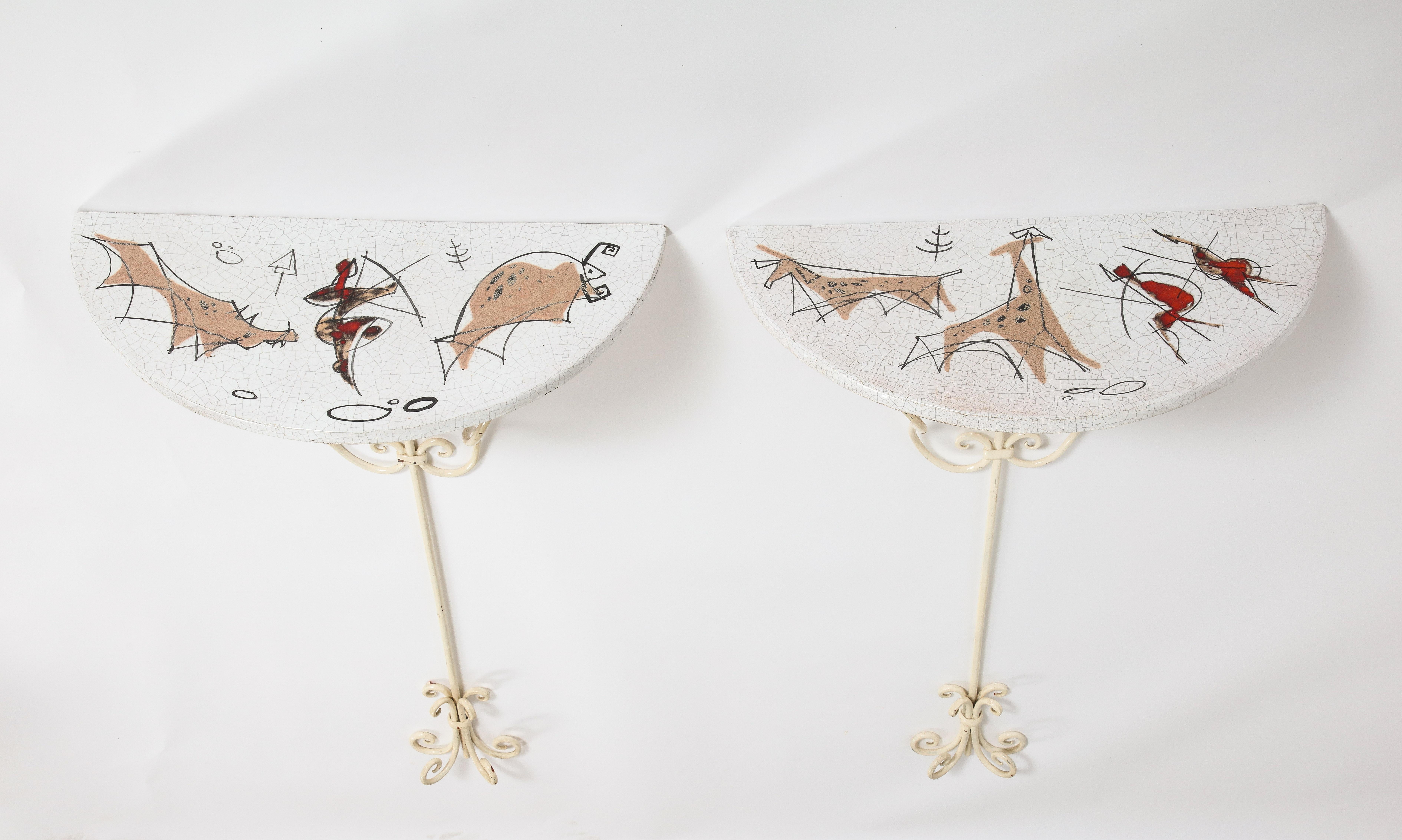 A pair of painted ceramic demi-lune wall consoles, by ceramist and artist Arnaldo Miniati, signed and dated 1959.  
Size: 37 1/4