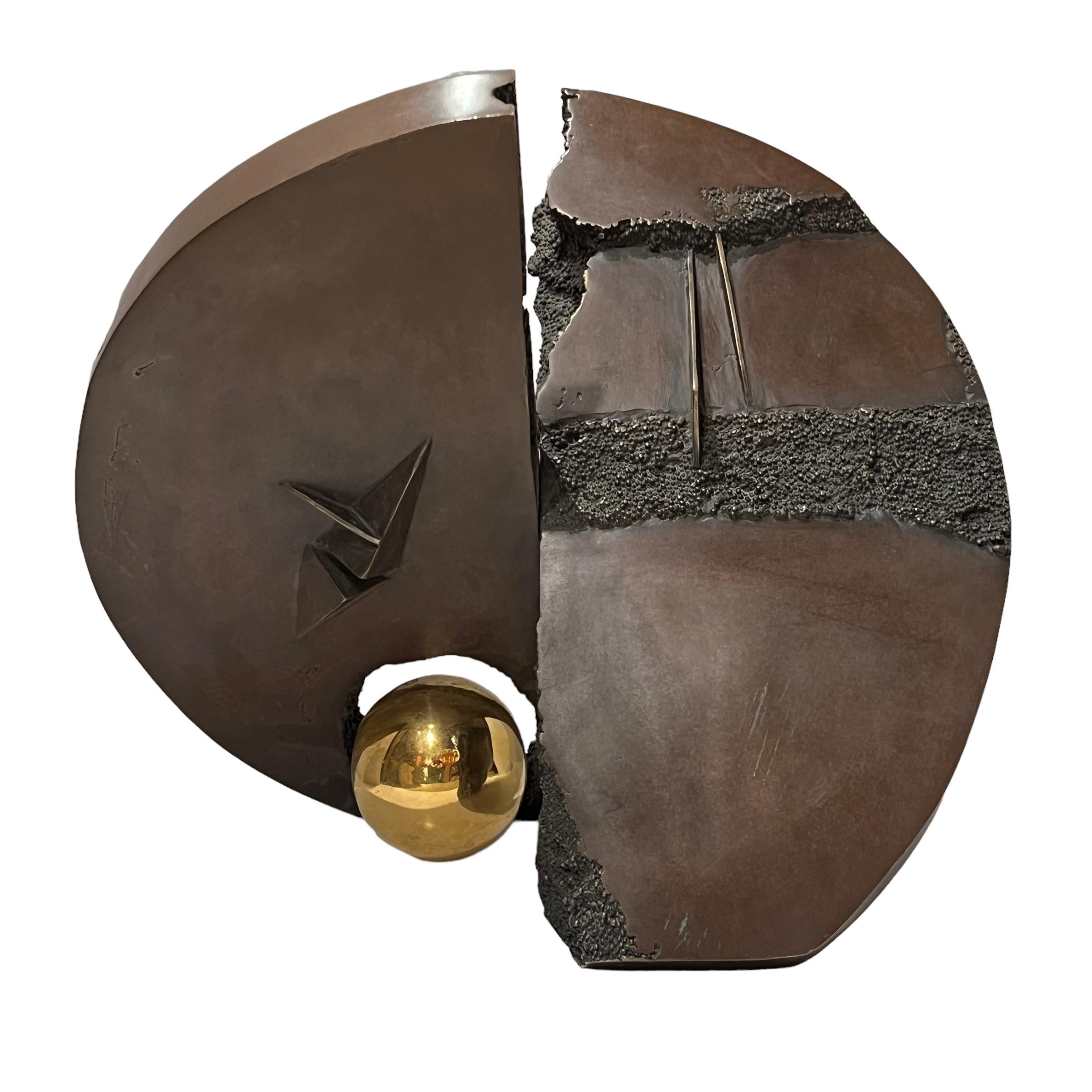 Abstract sculpture attributed to Arnaldo Pomodoro (1926- ), depicting a fractured disc or wheel, 21 by 19 by 12.5 inches, in bronze with warm brown patina and sphere in polished bronze.  Unsigned.

Similar to the artist's Ruota (Wheel), Disco (Disc)