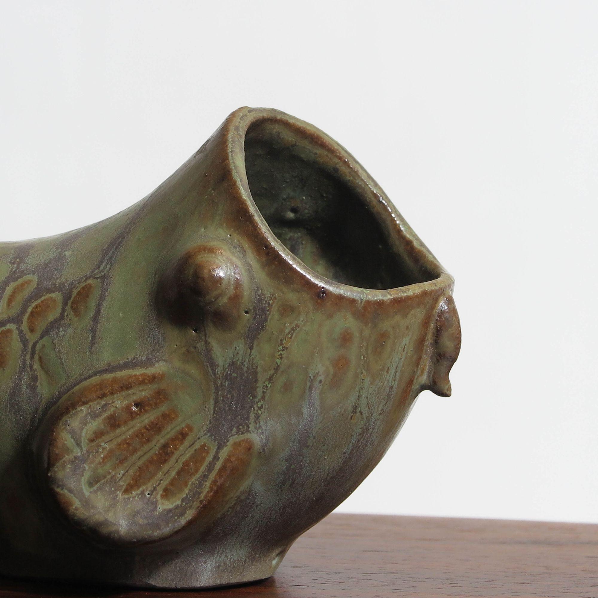 Arne Bang Danish Ceramic fish in a beautiful glaze of varying greens and earth tones. Marked AB.