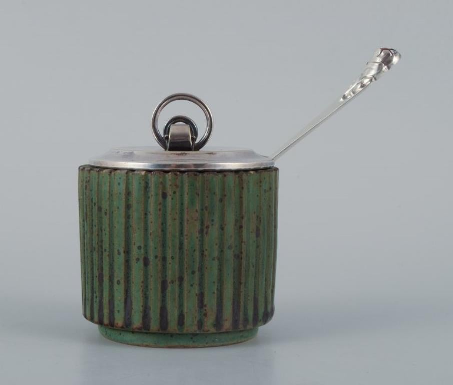 Danish Arne Bang, ceramic jam jar in grooved design.  Beautiful dark green glaze. For Sale