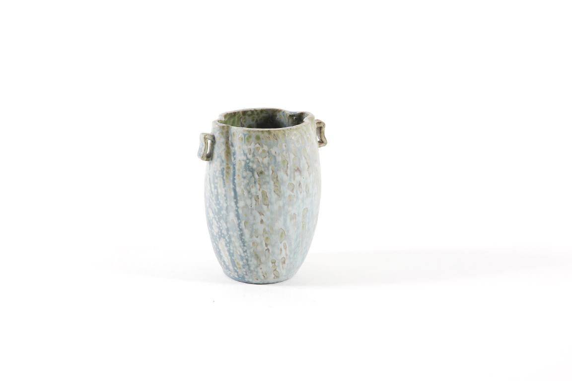 Danish ceramic stoneware by Arne Bang (1901-1983), circa 1950.
Two handles vase with a beautiful blue / grey crystallized enamel.
Signed by the ceramist Artist, monogram 