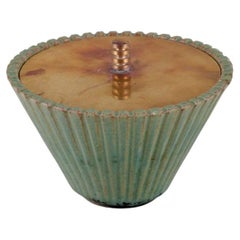 Arne Bang. Ceramic vase with lid in patinated brass. Mid-20th C.