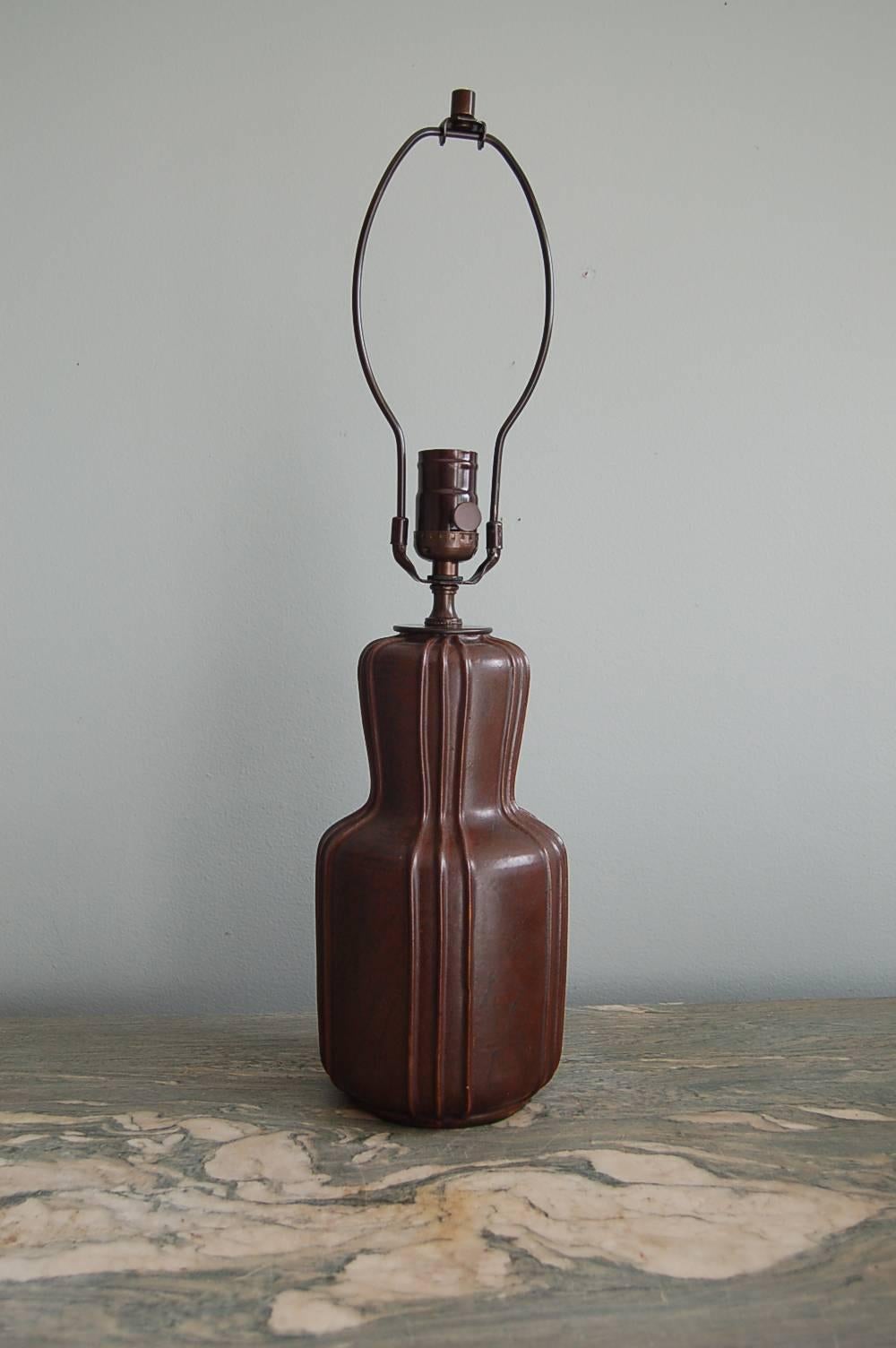 Arne Bang (1901 Frederiksberg-Fensmark, Denmark 1983), double gourd-shaped table lamp, earthenware with brown glaze, circa 1930.

Arne Bang began his career as an apprentice to noted sculptor and ceramicist Niels Hansen Jacobsen. He went on to