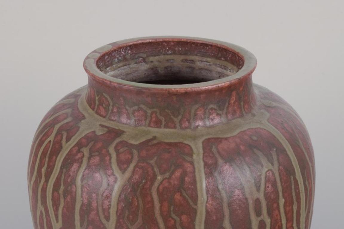 Danish Arne Bang, own workshop. Large ceramic vase decorated in shades of brown. For Sale