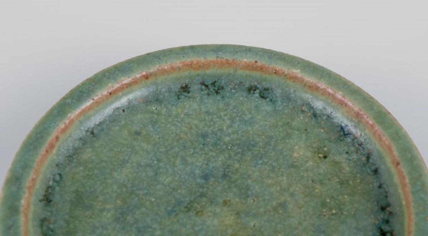 Scandinavian Modern Arne Bang, own workshop. Small ceramic dish decorated in blue-green glaze.