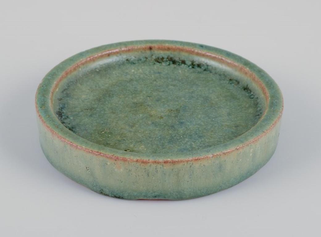 Danish Arne Bang, own workshop. Small ceramic dish decorated in blue-green glaze.