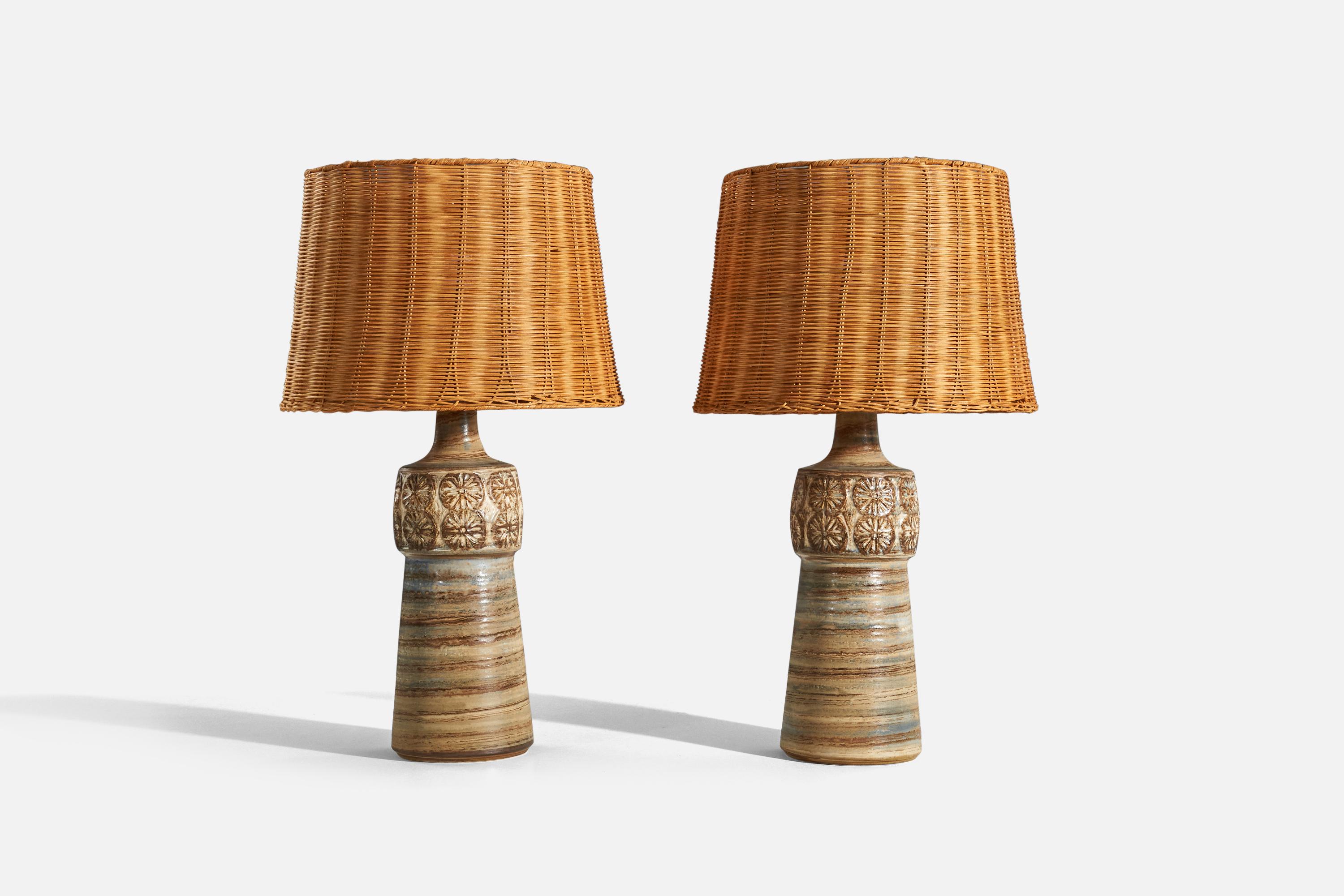A pair of brown and blue, glazed stoneware table lamps designed and produced by Arne Finne, Denmark, c. 1960s. 

Sold with lampshades upon request. 
Dimensions of Lamp (inches) : 21.43 x 7 x 7 (H x W x D)
Dimensions of Shade (inches) : 13.5 x