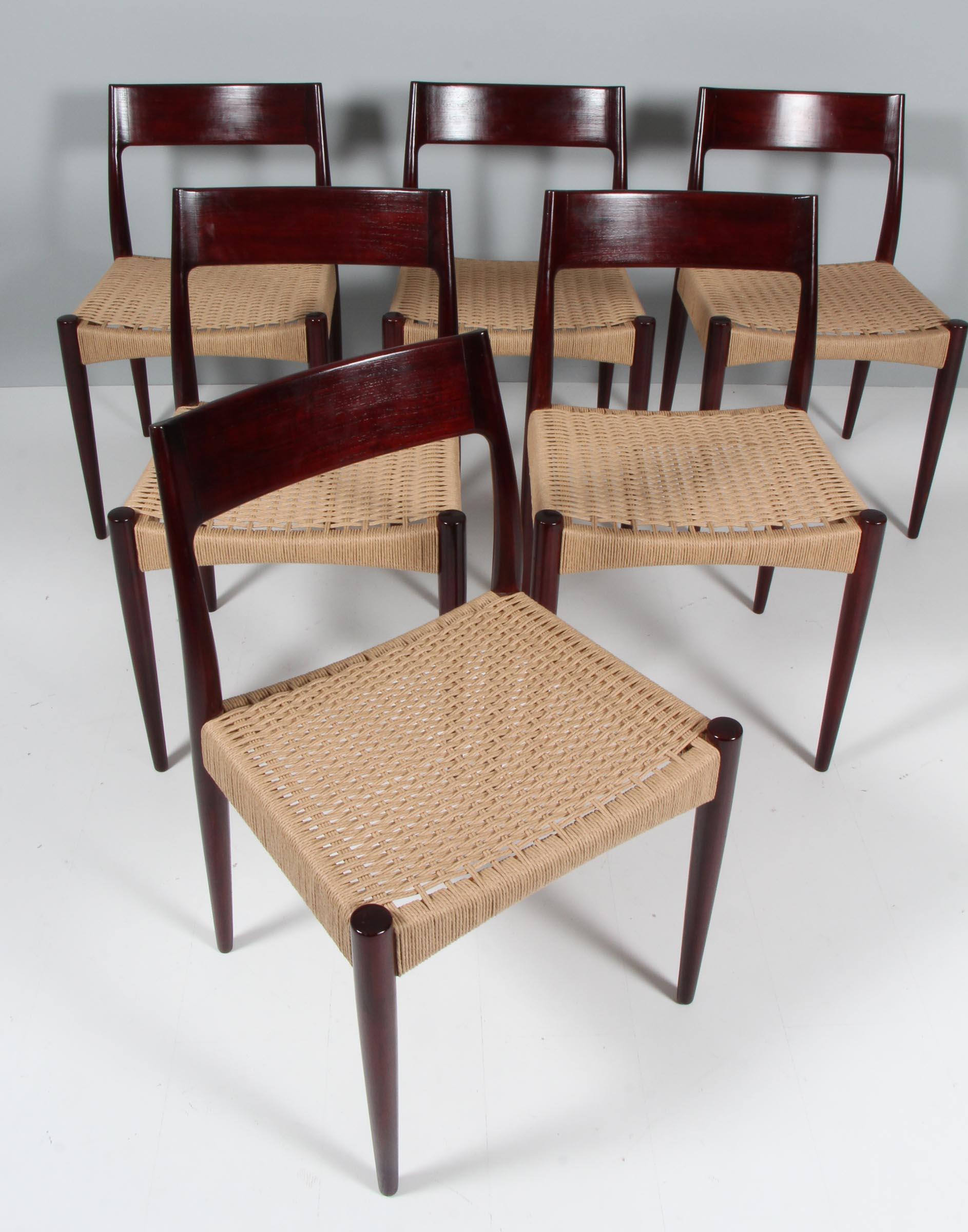 Arne Hovmand-Olsen. Set of dining chairs in mahogany.

New weaved seats in papercord.

Made by Mogens Kold.