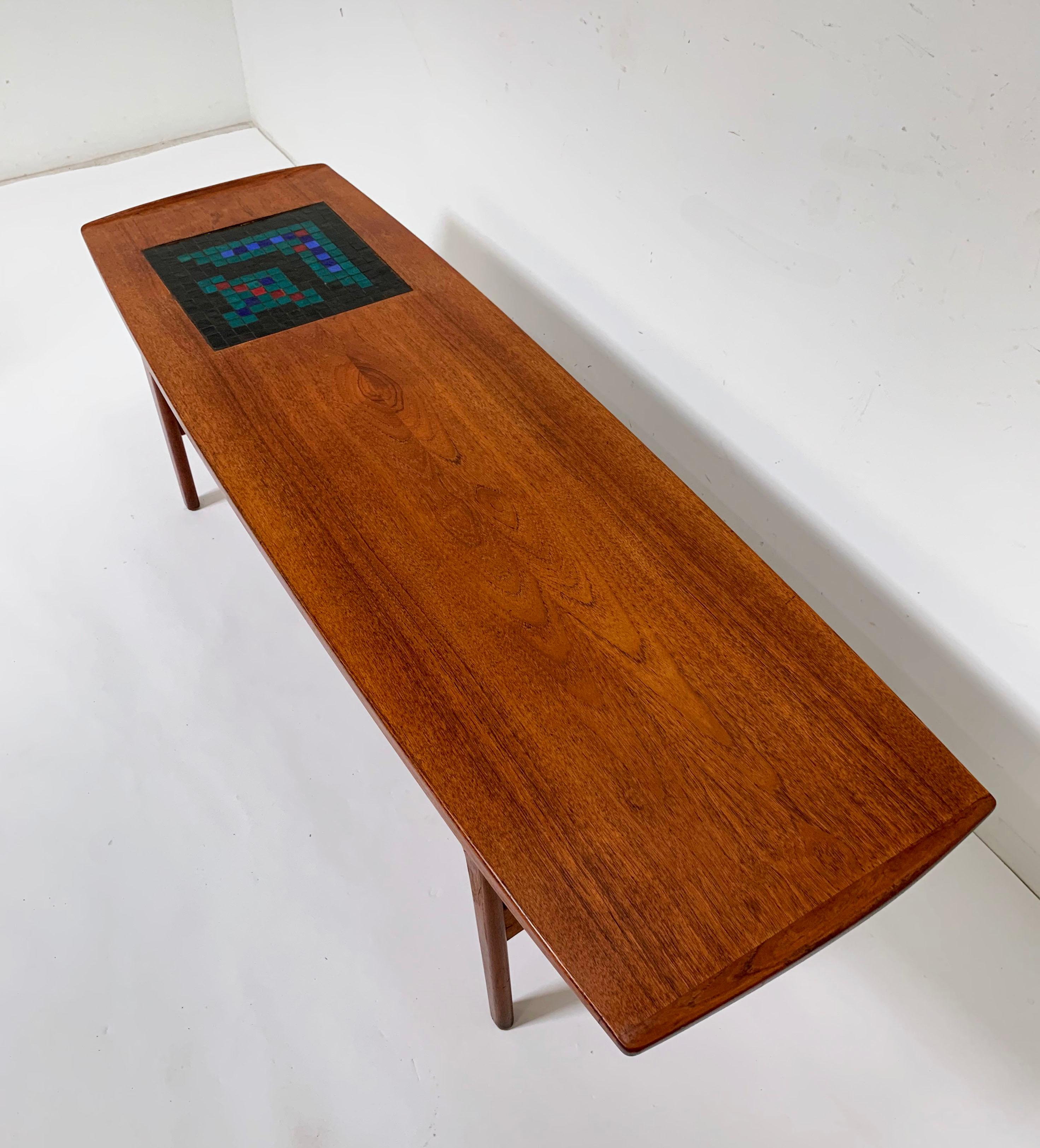 Classic Danish modern coffee table designed by Arne Hovmand-Olsen and produced by Mogens Kold, circa 1957. It is relatively rare to find examples of this model in the United States. Features a glass mosaic panel on top with a freshly rewoven cane