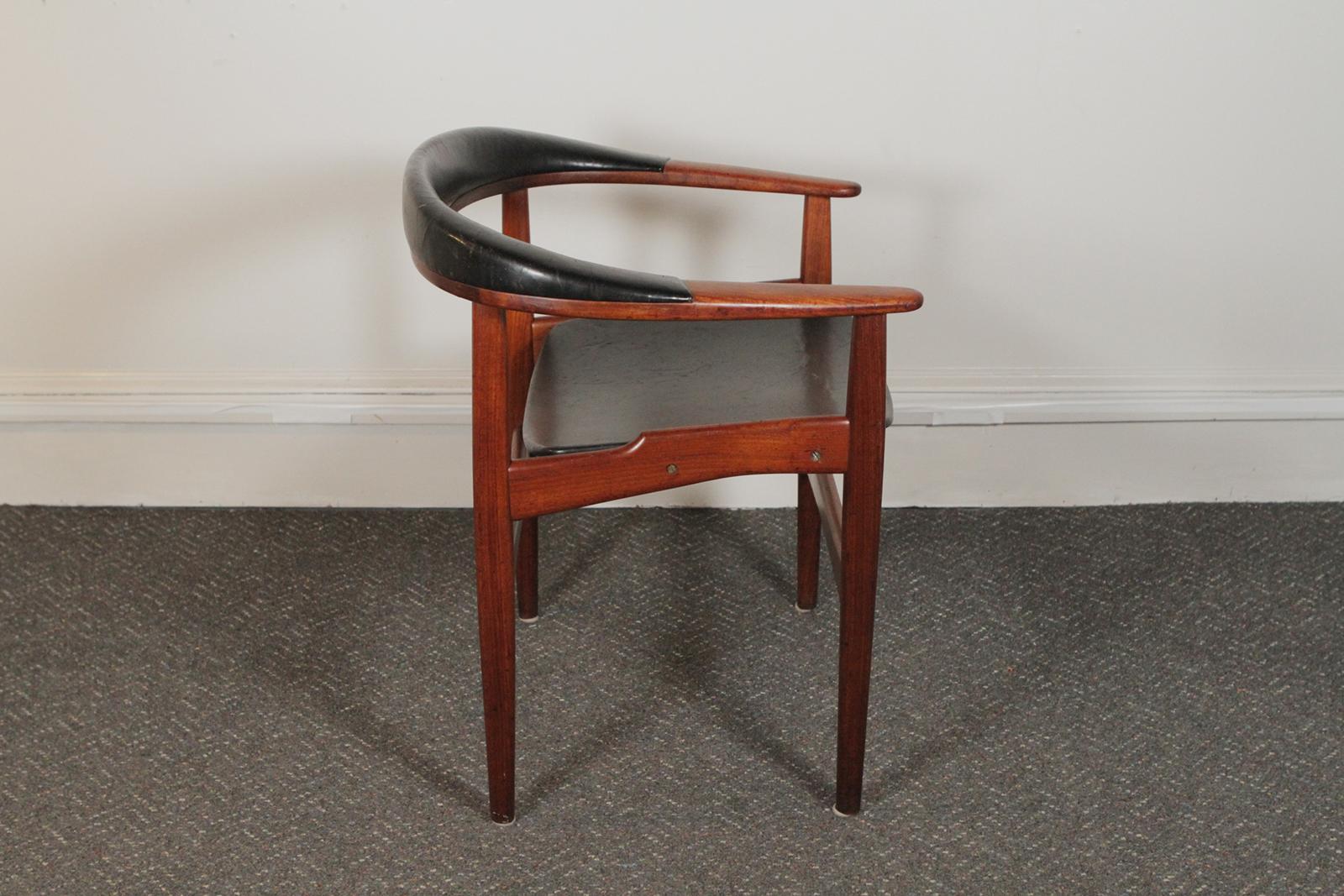 Arne Hovmand-Olsen for Jutex, DK, circa 1957 (Teak + original leather) the rounded back with leather upholstery. The leather is original showing signs of use and the frame is in excellent condition. The chair is signed on the underside of the