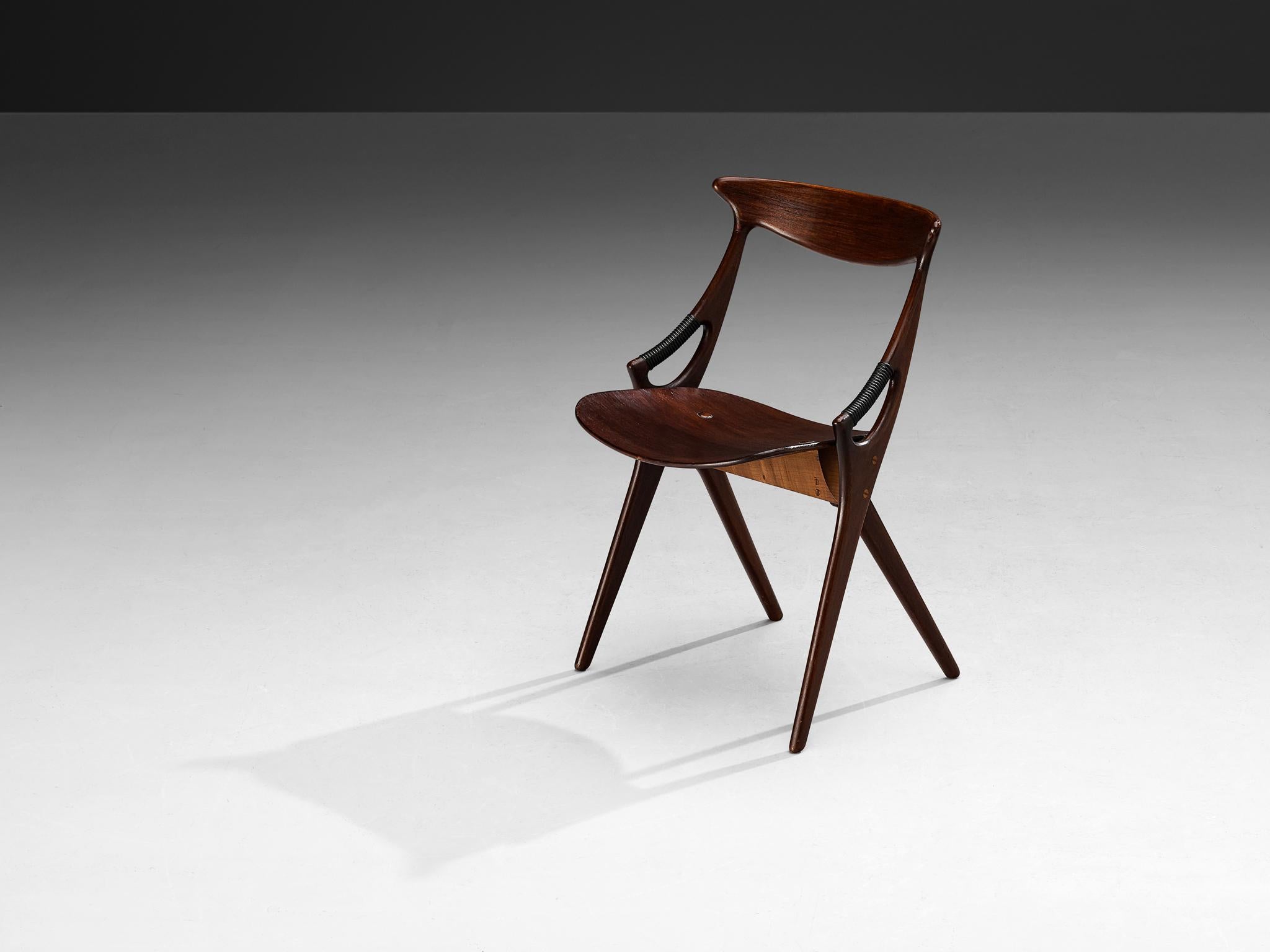 Arne Hovmand-Olsen for Mogens Kold Møbelfabrik, dining chair, model 71, mahogany, brass, Denmark, 1959 

This sculptural chair is designed by the Dane Arne Hovmand-Olsen for Mogens Kold Møbelfabrik. The chair is organic in its shape as can be seen