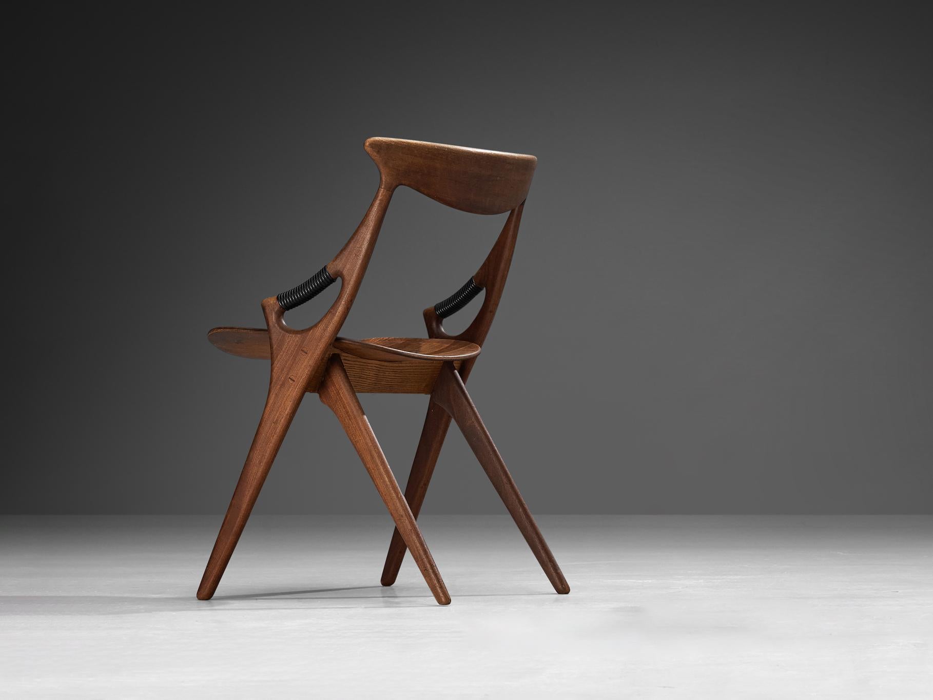 Arne Hovmand-Olsen for Mogens Kold Møbelfabrik, dining chair, model 71, mahogany, brass, Denmark, 1959 

This sculptural chair is designed by the Dane Arne Hovmand-Olsen for Mogens Kold Møbelfabrik. The chair is organic in its shape as can be seen