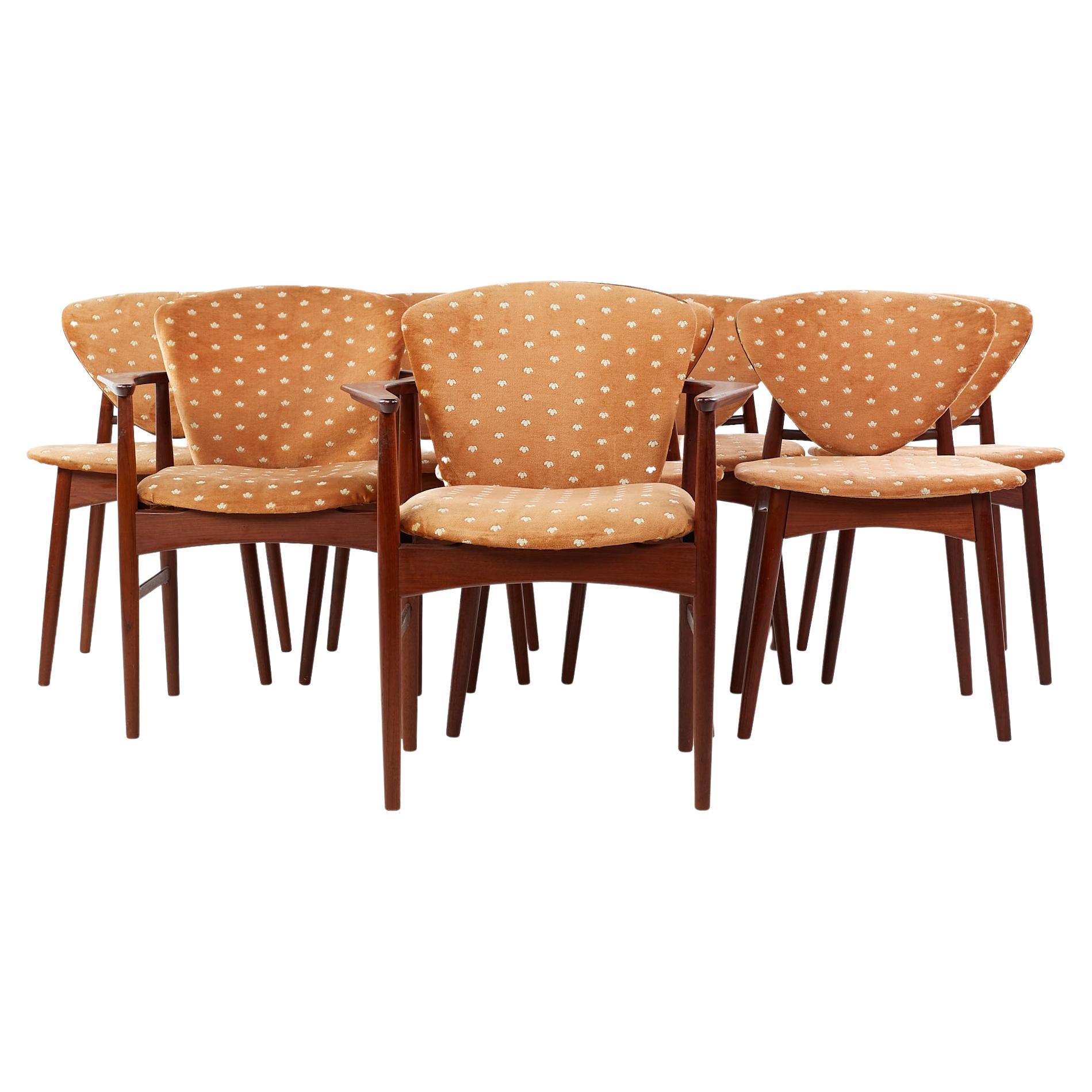 Arne Hovmand Olsen for Onsild Mobelfabrik mid century teak dining chairs - set of 8.

Each armless chair measures: 20 wide x 23 deep x 31 high, with a seat height of 18 inches.
Each captains chair measures: 27 wide x 23 deep x 32 high, with a
