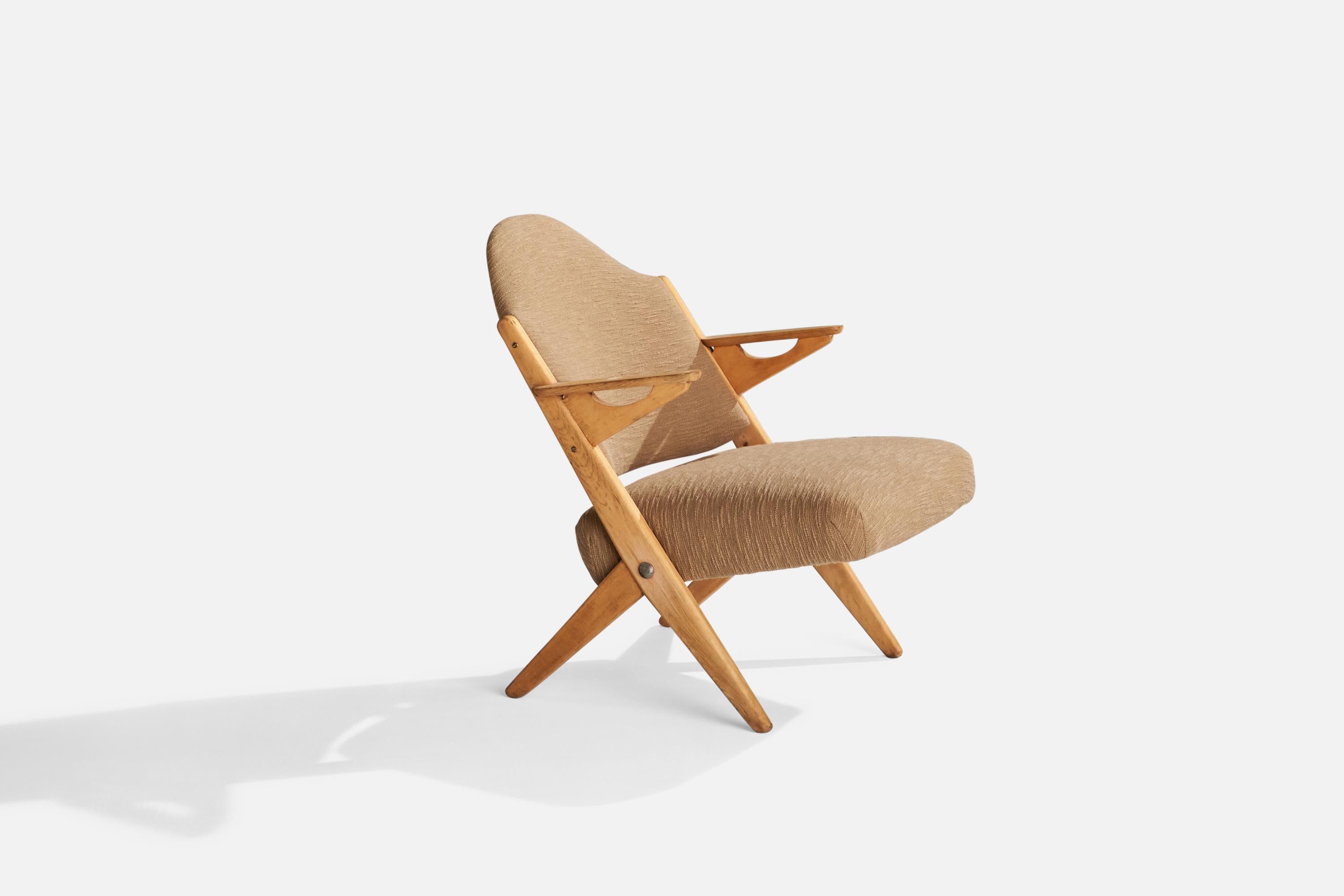 A beech and beige fabric lounge chair designed by Arne Hovmand-Olsen and produced by Komfort Randers, Denmark, 1950s.

Seat height 16”.