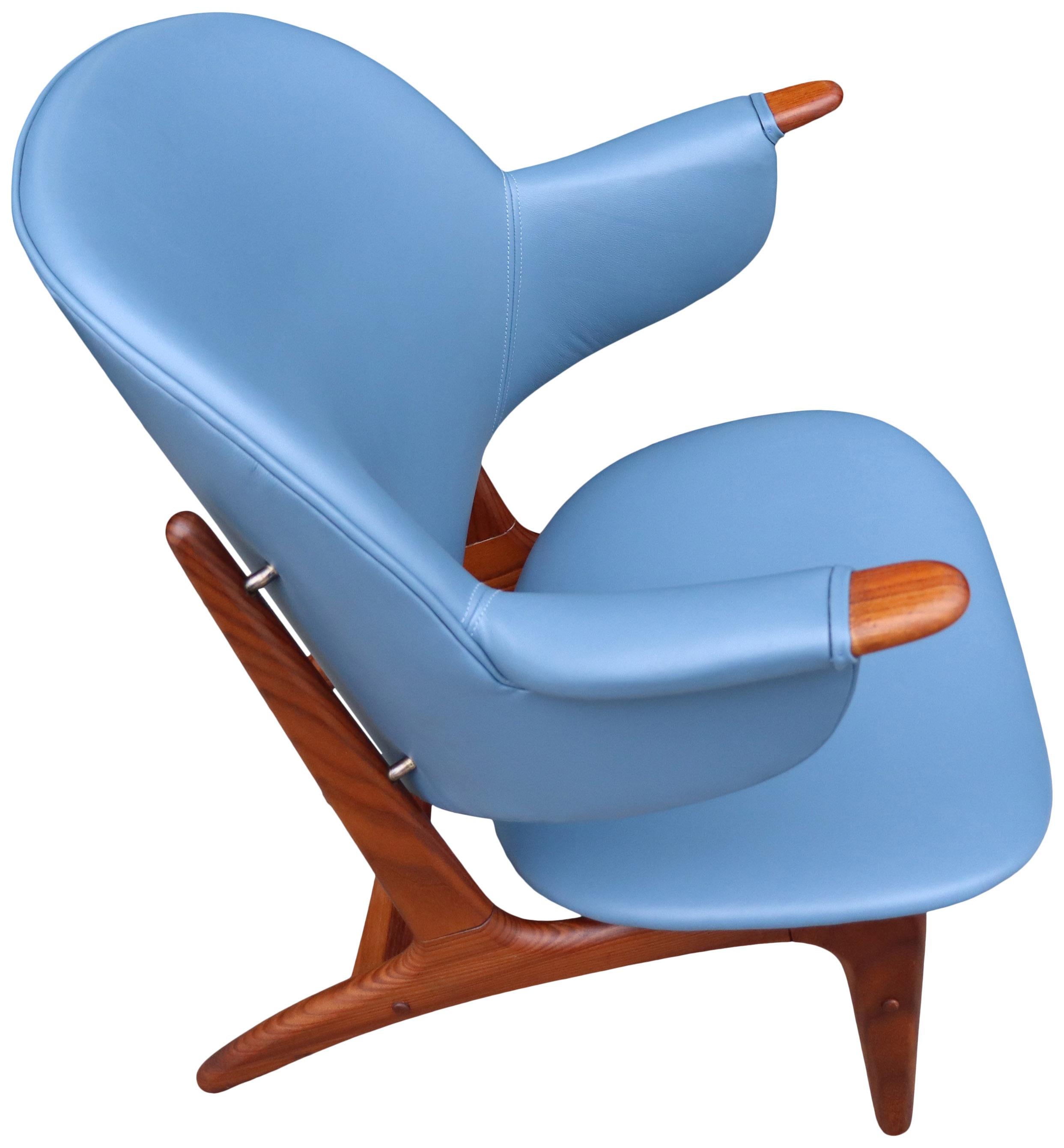 For your consideration is this incredibly rare lounge chair by Arne Hovmand-Olsen. Newly recovered in luxurious leather. This rather petite lounge chair fits perfectly into the human form. Often referred to the baby Papa bear chair referring to