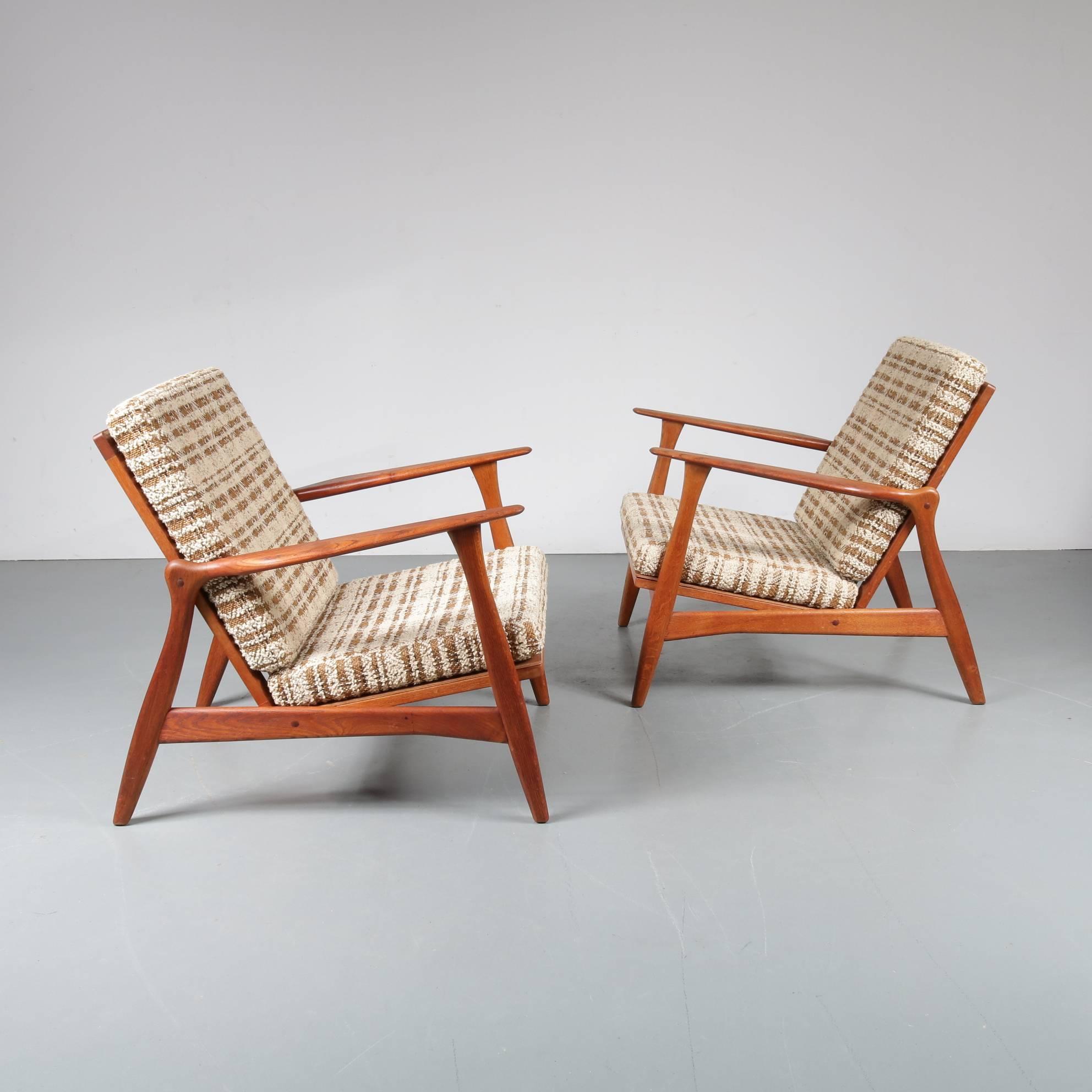A beautiful pair of very rare lounge chairs designed by Arne Hovmand Olsen, produced by Mogens Kold in Denmark around 1950.

These chairs are perfect examples of quality midcentury Danish design! Made of high quality warm brown colored teak wood,