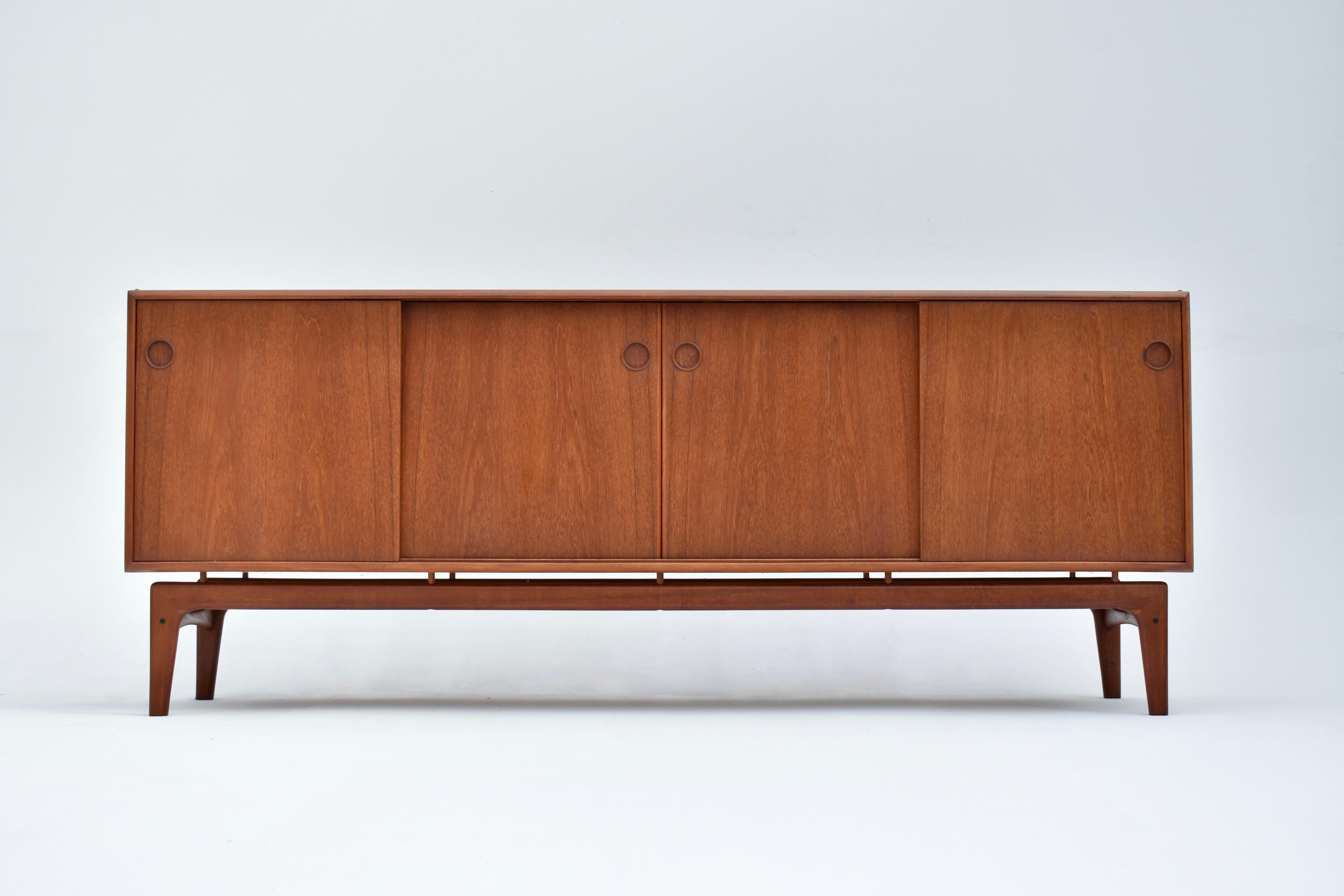 Very hard to find sideboard designed by Arne Hovmand Olsen for Mogens Kold, Denmark.

A very handsome and finely detailed design with beautiful sculptural qualities. The carcass appears to float above the leg frame allowing light to pass through