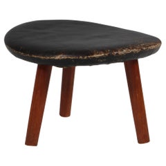 Arne Hovmand Olsen ottoman in black patinated leather and teak. 1960s