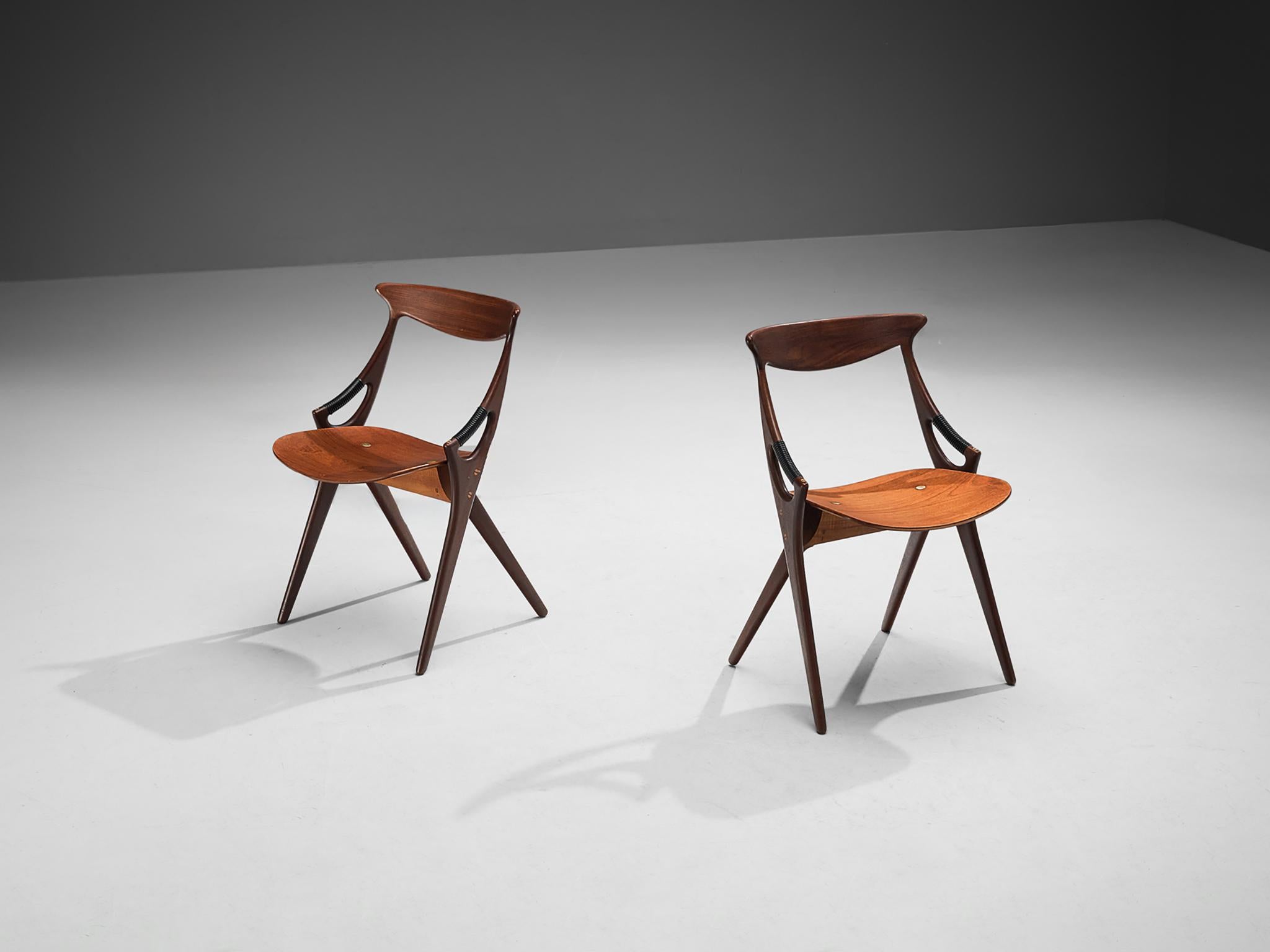 Arne Hovmand-Olsen for Mogens Kold Møbelfabrik, dining chairs, model 71, teak, brass, Denmark, 1959 

This sculptural pair of dining chairs is designed by the Danish designer Arne Hovmand-Olsen for Mogens Kold Møbelfabrik. The chair is organic in