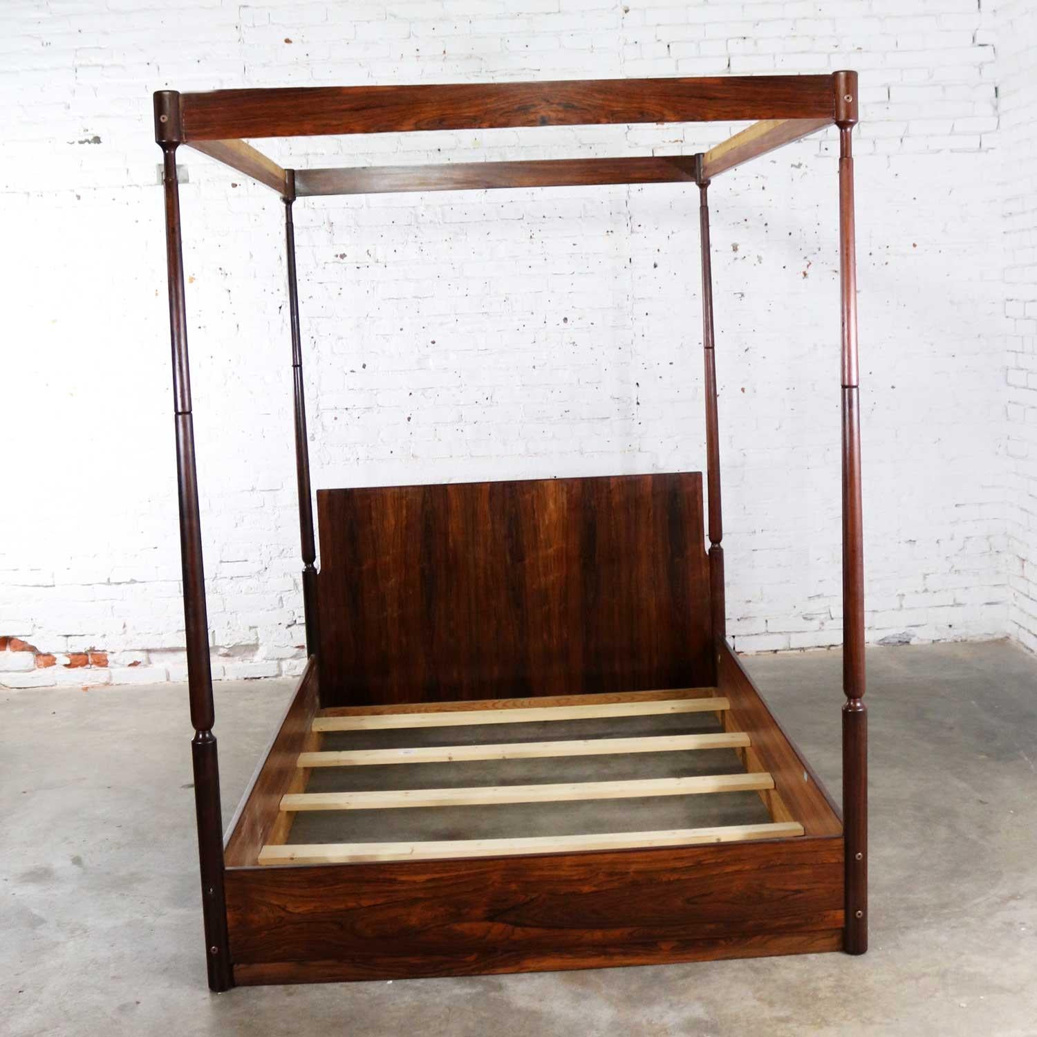 Handsome rosewood Scandinavian Mid-Century Modern full-size canopy bed designed by Arne Hovmand-Olsen for his studio Design Arne Hovmand-Olsen. This bed is in wonderful vintage condition with the normal wear you would see for its age and use, circa