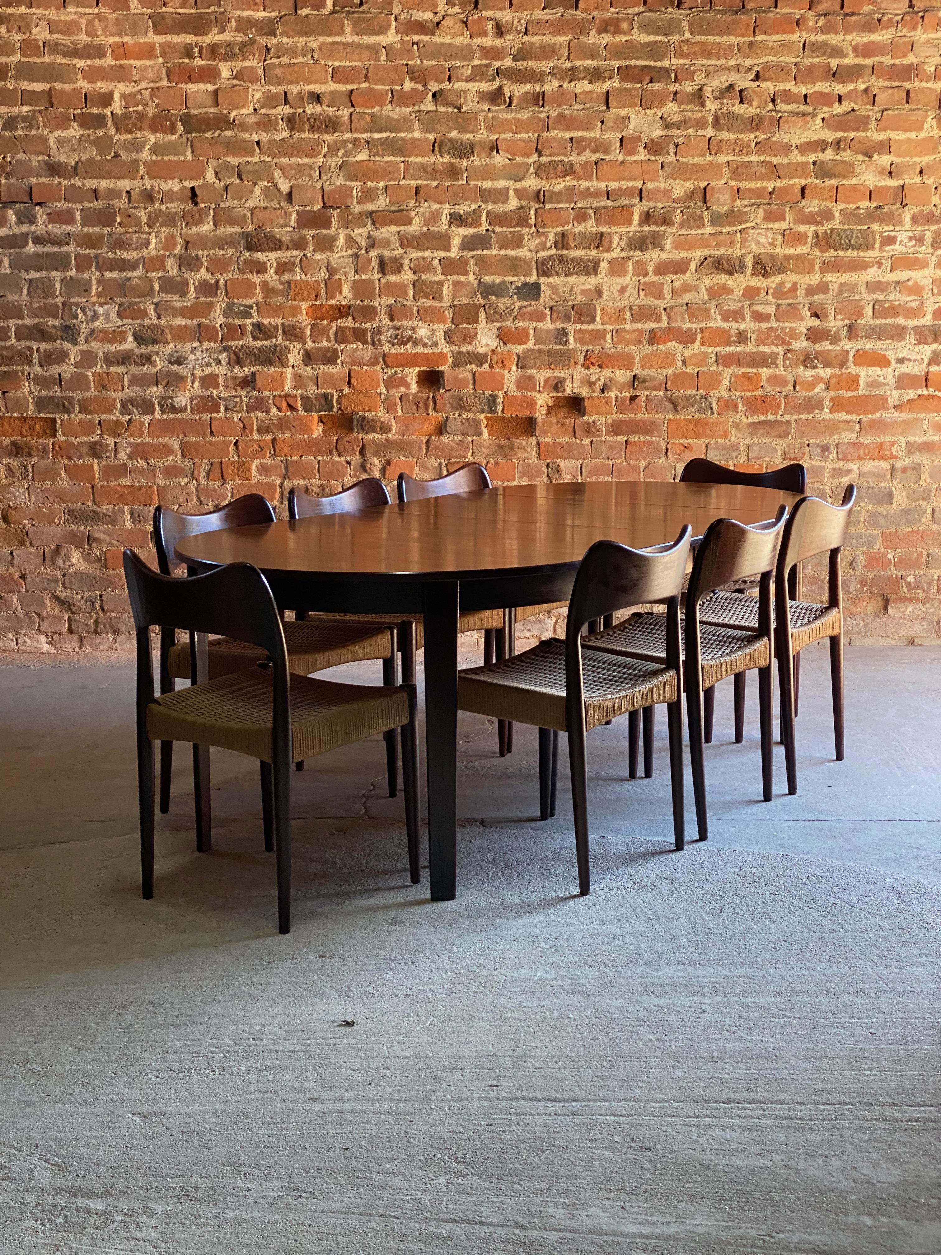 Arne Hovmand Olsen Round Rosewood Dining Table & 8 Dining Chairs by Mogens Kold 1960

Magnificent mid-century Danish design Arne Hovmand-Olsen Round Rosewood Dining Table and Eight matching Rosewood and Paper Cord dining chairs manufactured by