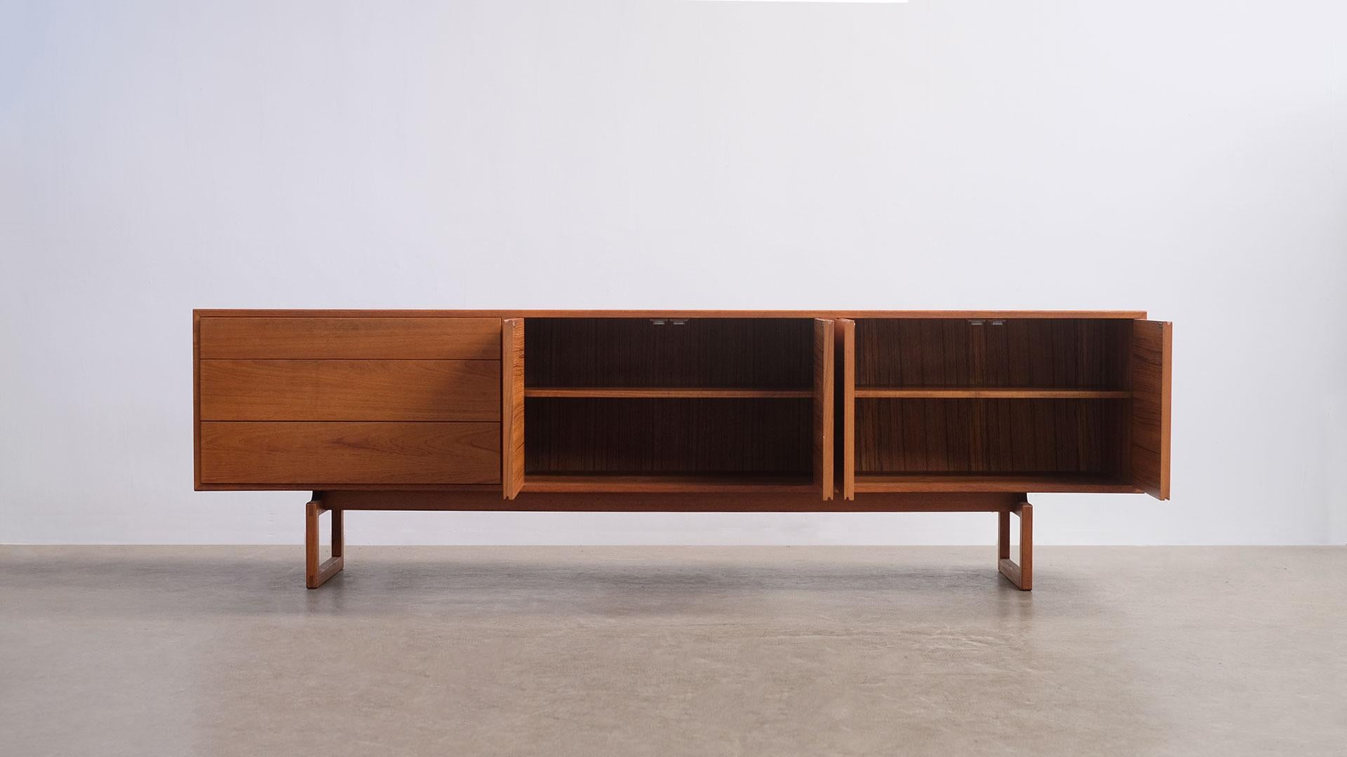 Rare and wonderful low sideboard in teak designed by Arne Hovmand Olsen for Mogens Kold, Denmark. Superb minimalistic design with clean, simple details and super elegant proportions. Beautiful original condition.