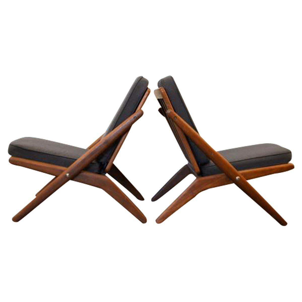 Set of two rare vintage Danish design “scissor” chairs designed by Arne Hovmand Olsen for Danish manufacturer Jutex. These Mid-Century Modern scissor chair comfortably combines unique aesthetics to make a dramatic statement in any space. The unique