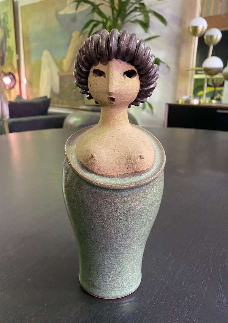 A wonderful piece by Danish designer Arne Bang and his son Jacob. This ceramic Japanese geisha figure is truly whimsical and special. 

Beautifully glazed and signed with artist's mark and number on the base. 

A somewhat rare and hard to find