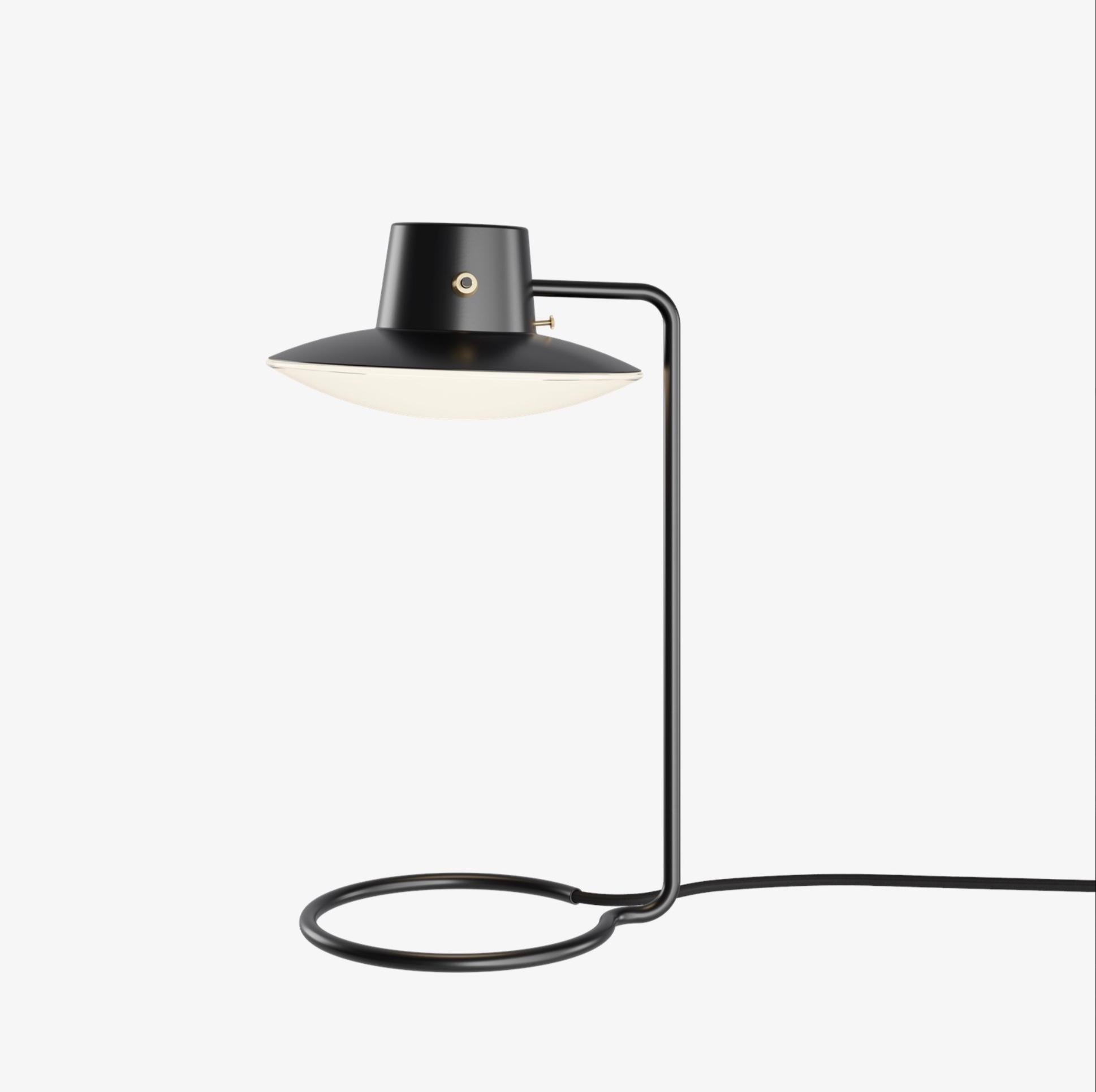 Arne Jacobsen AJ Oxford table lamp 410mm in black and opaline for Louis Poulsen. Designed in 1963, current production.

The AJ Oxford Table Lamp has a sleek graphic expression, which reflects the architecture of St Catherine's College, in Oxford,