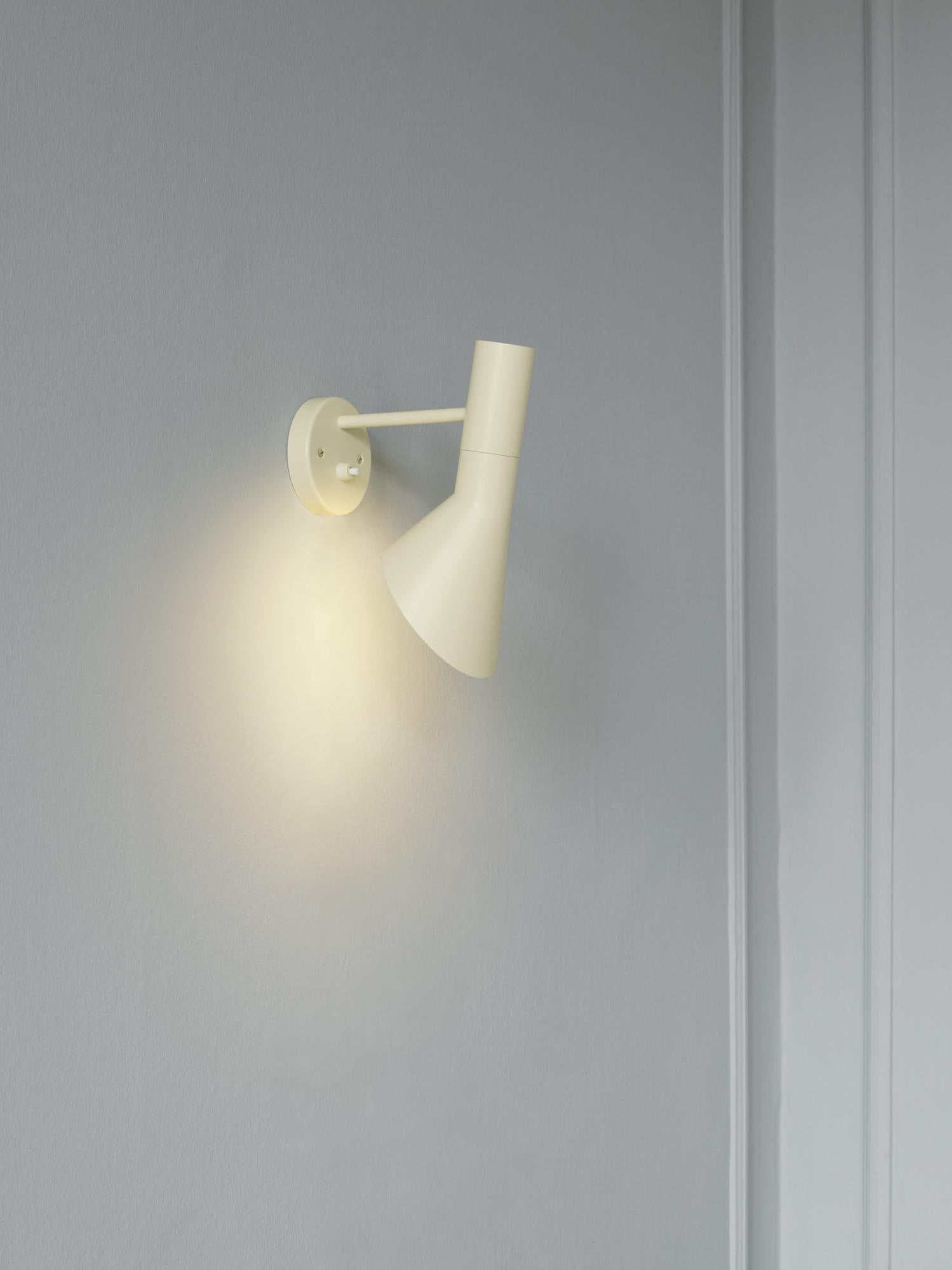 Arne Jacobsen AJ Wall Light for Louis Poulsen in Soft Lemon.
The AJ series was part of the lighting Jacobsen designed for the original SAS Royal Hotel. Today, his furniture and lighting designs are sought after by collectors worldwide. Executed in