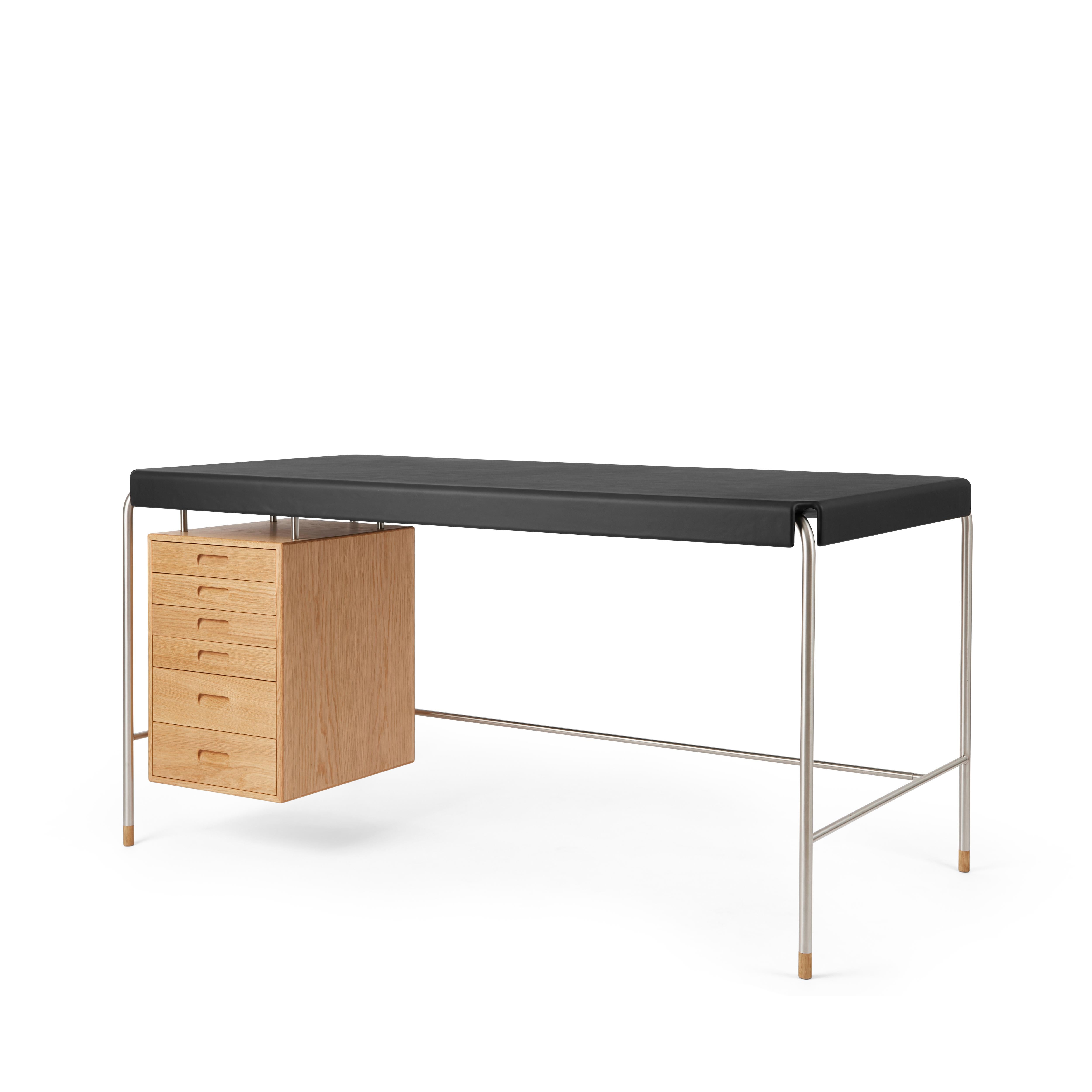 Arne Jacobsen 'AJ52' Desk in Oiled Oak and Leather for Carl Hansen & Son

The story of Danish Modern begins in 1908 when Carl Hansen opened his first workshop. His firm commitment to beauty, comfort, refinement, and craftsmanship is evident in