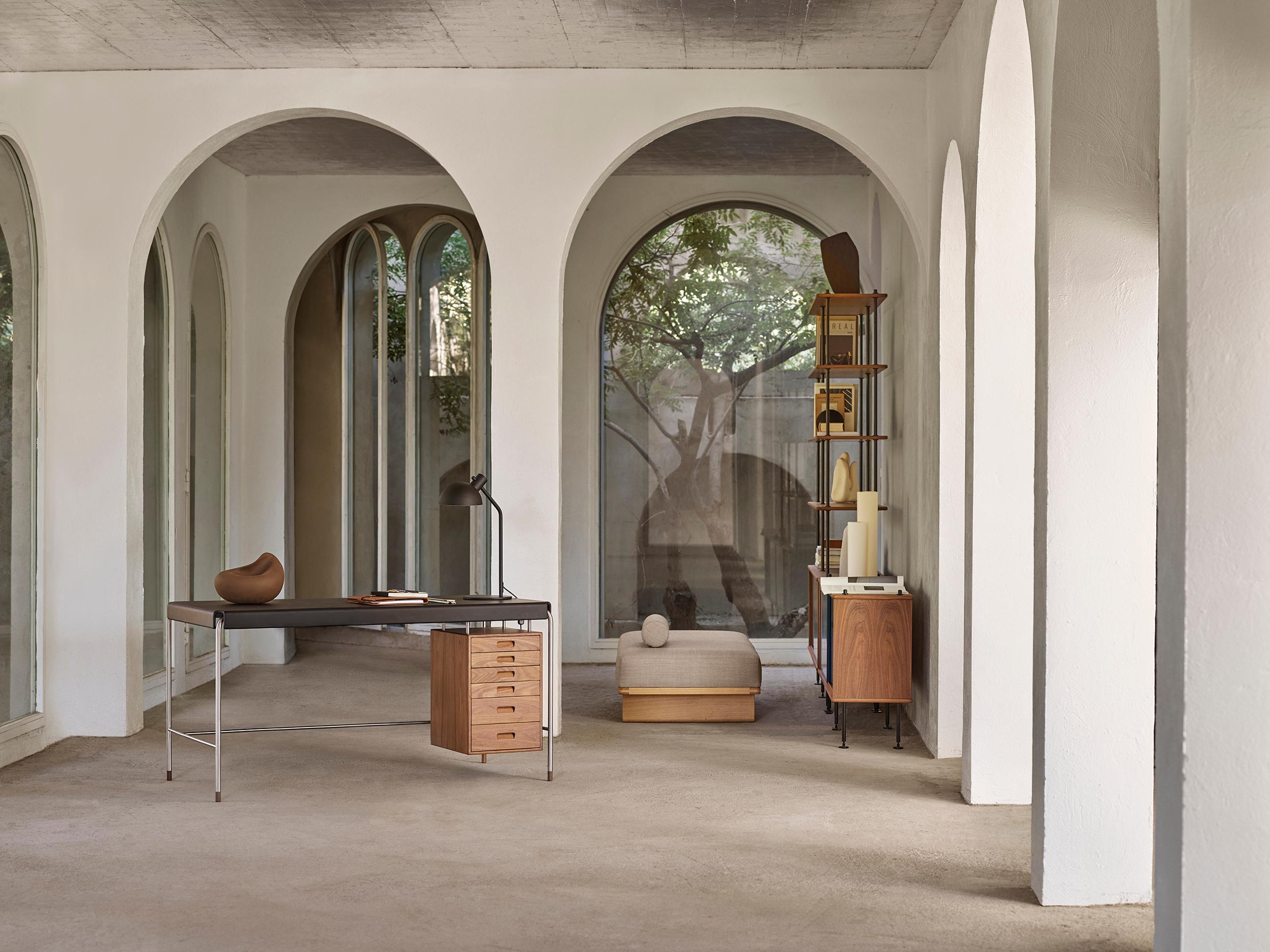 Arne Jacobsen 'AJ52' Desk with Lamp in Walnut & Leather for Carl Hansen & Son

The story of Danish Modern begins in 1908 when Carl Hansen opened his first workshop. His firm commitment to beauty, comfort, refinement, and craftsmanship is evident in