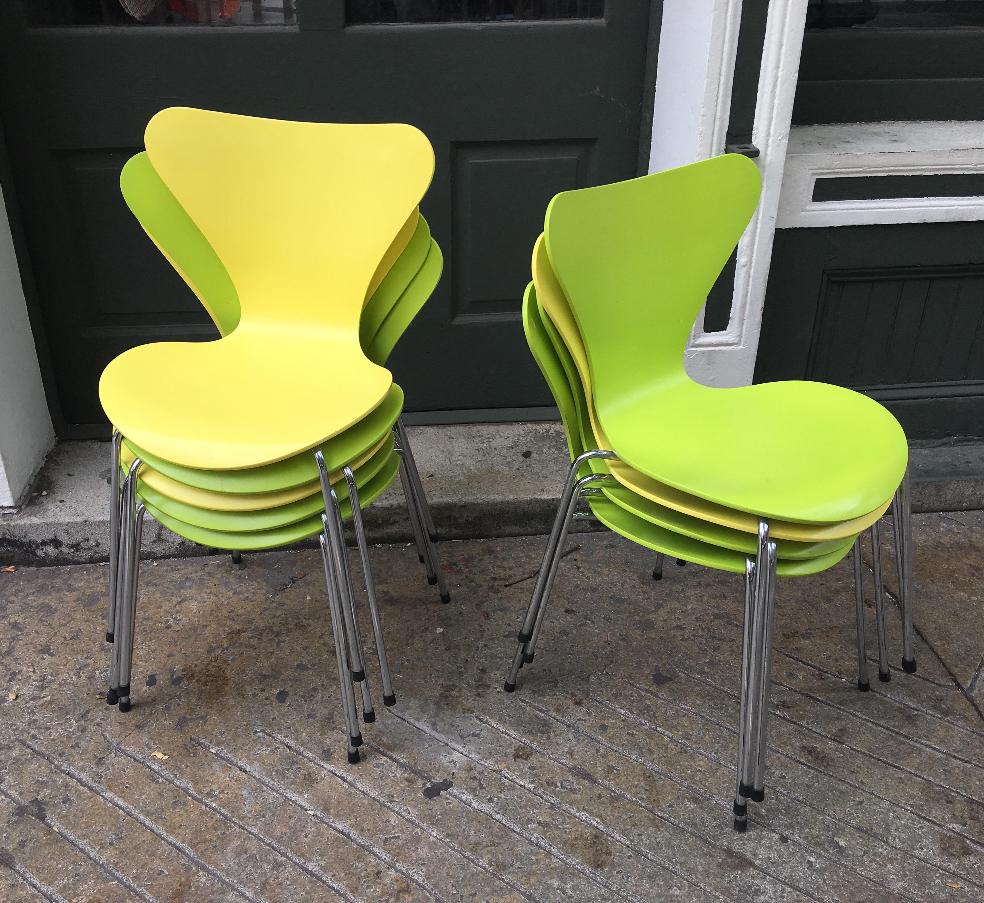 Nice grouping of Arne Jacobsen stacking Ant chairs. 1955 design, chairs have been in constant production, and often copied. These chairs from 1998 are the licenced models from Fritz Hansen. Three yellow and six green available. Chairs are priced by