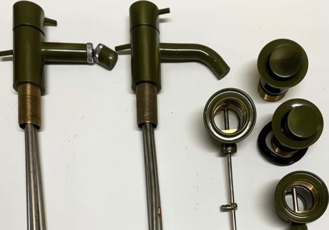 Arne Jacobsen Bath Basin & Bidet Vola Mixer Faucet set, Moss Green, New in Box, 1960s. Extremely rare midcentury piece, moss green no longer available for custom order. 

Shortly after Arne Jacobsen won a competition in 1961 for his design of the