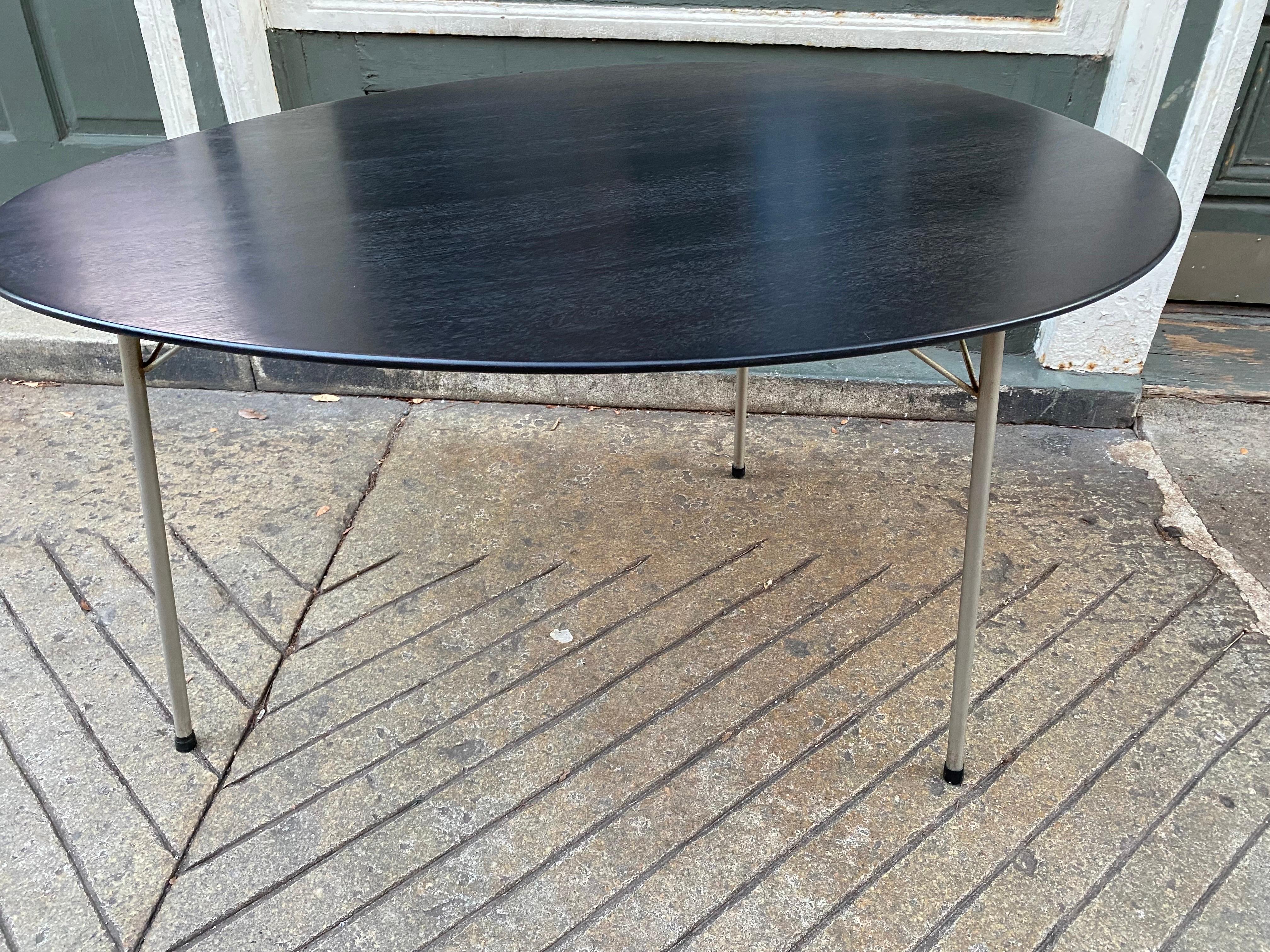 Arne Jacobsen egg table. Newly refinished ebonized black finish. Perfect to use in a small dining area or as a writing desk. Great classic Danish design!