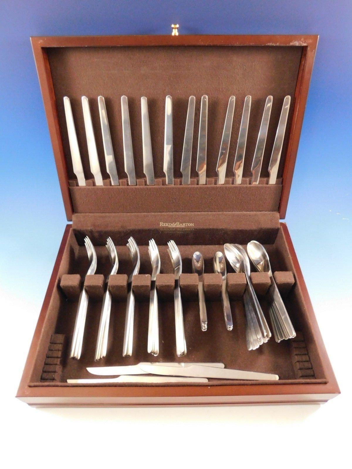 Arne Jacobsen by Georg Jensen stainless steel flatware set of 80 pieces. This set includes:

16 dinner knives, 8