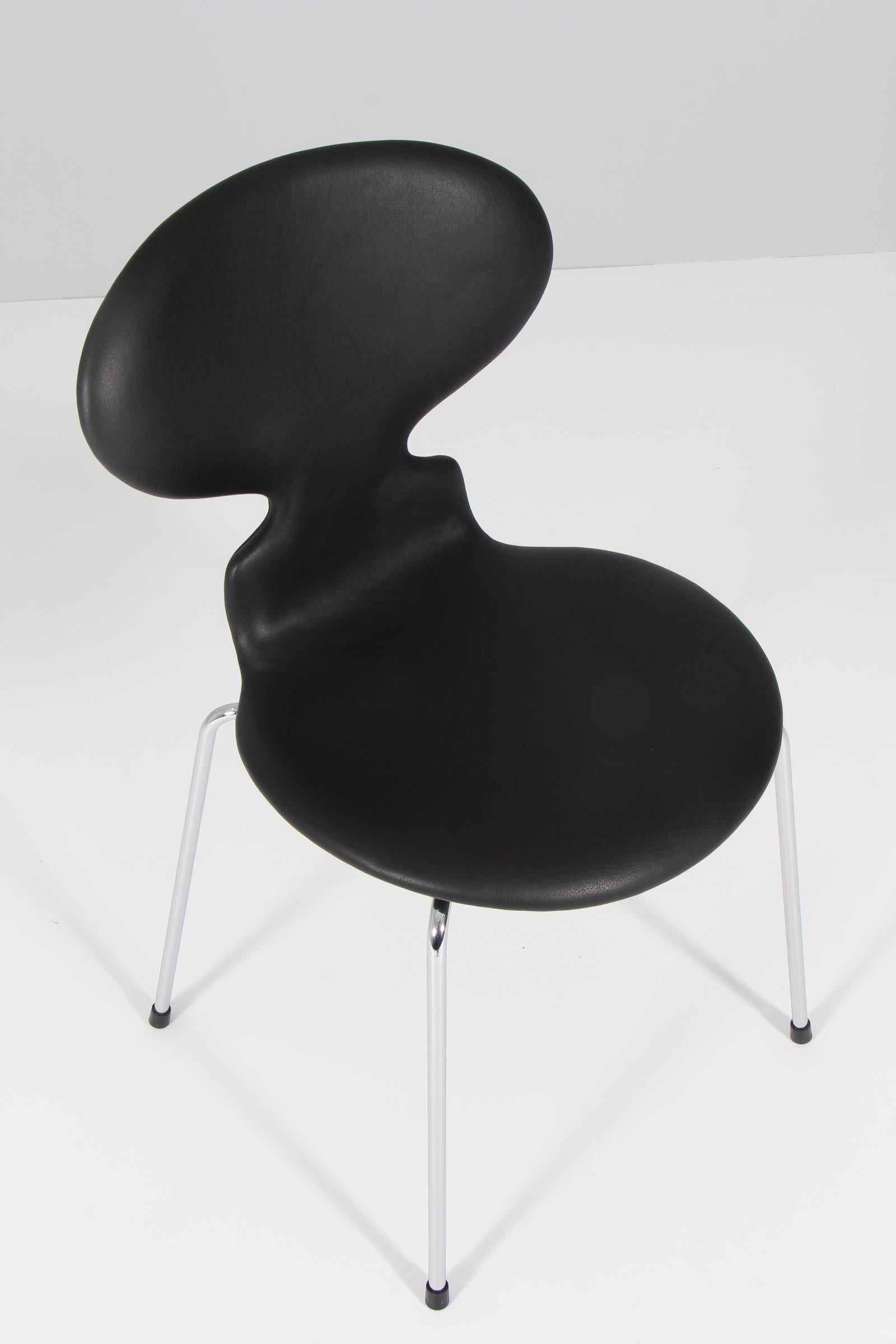 Arne Jacobsen dining chairs, new upholstered with black aniline leather. 

Chromed base. 

Model 3101 
