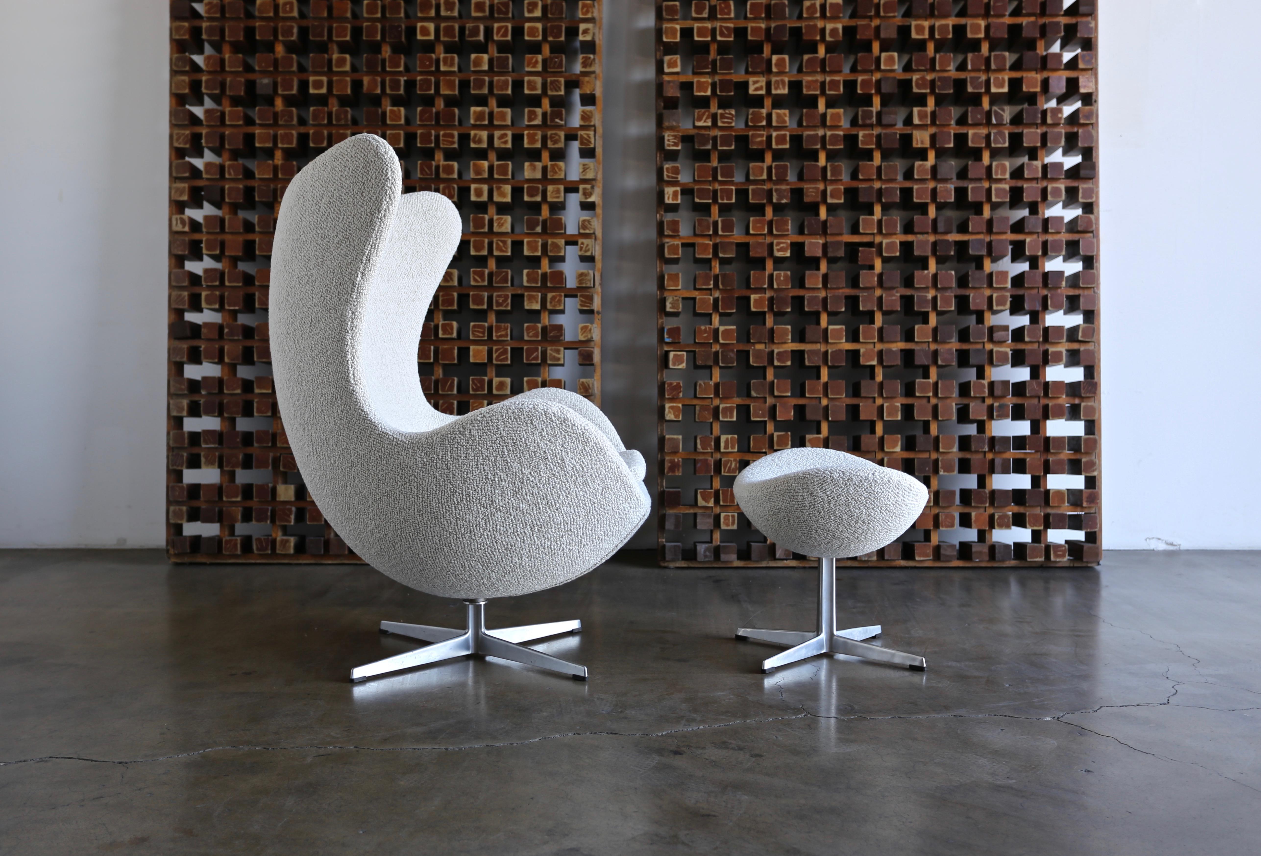 Egg chair and ottoman by Arne Jacobsen for Fritz Hansen, circa 1960. The chair retains the original Fritz Hansen label to the base. This chair and ottoman has been professionally restored.

The listed price is for one chair and ottoman. (Two Sets