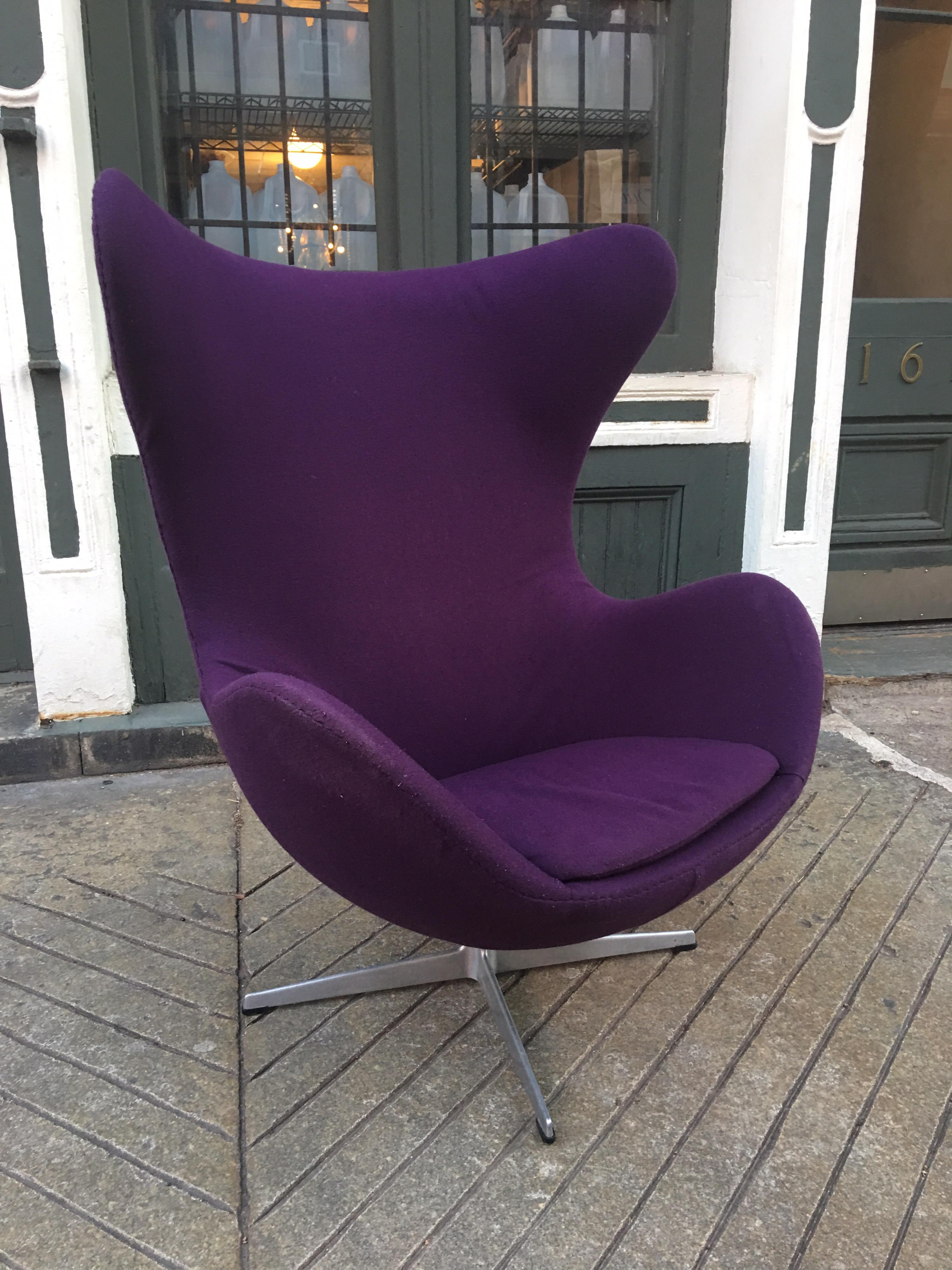Arne Jacobsen purple egg chair. Chair has older purple fabric that is still usable, but shows wear. We can offer upholstery services for the chair. Retains original labels and is dated 1972. Classic Danish chair!