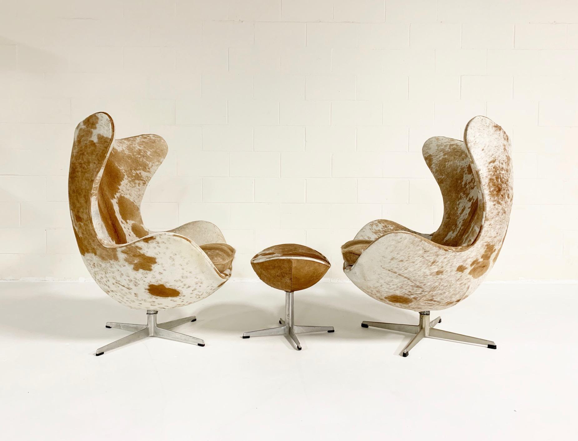 Mid-Century Modern Arne Jacobsen Egg Chairs and Ottoman in Brazilian Cowhide