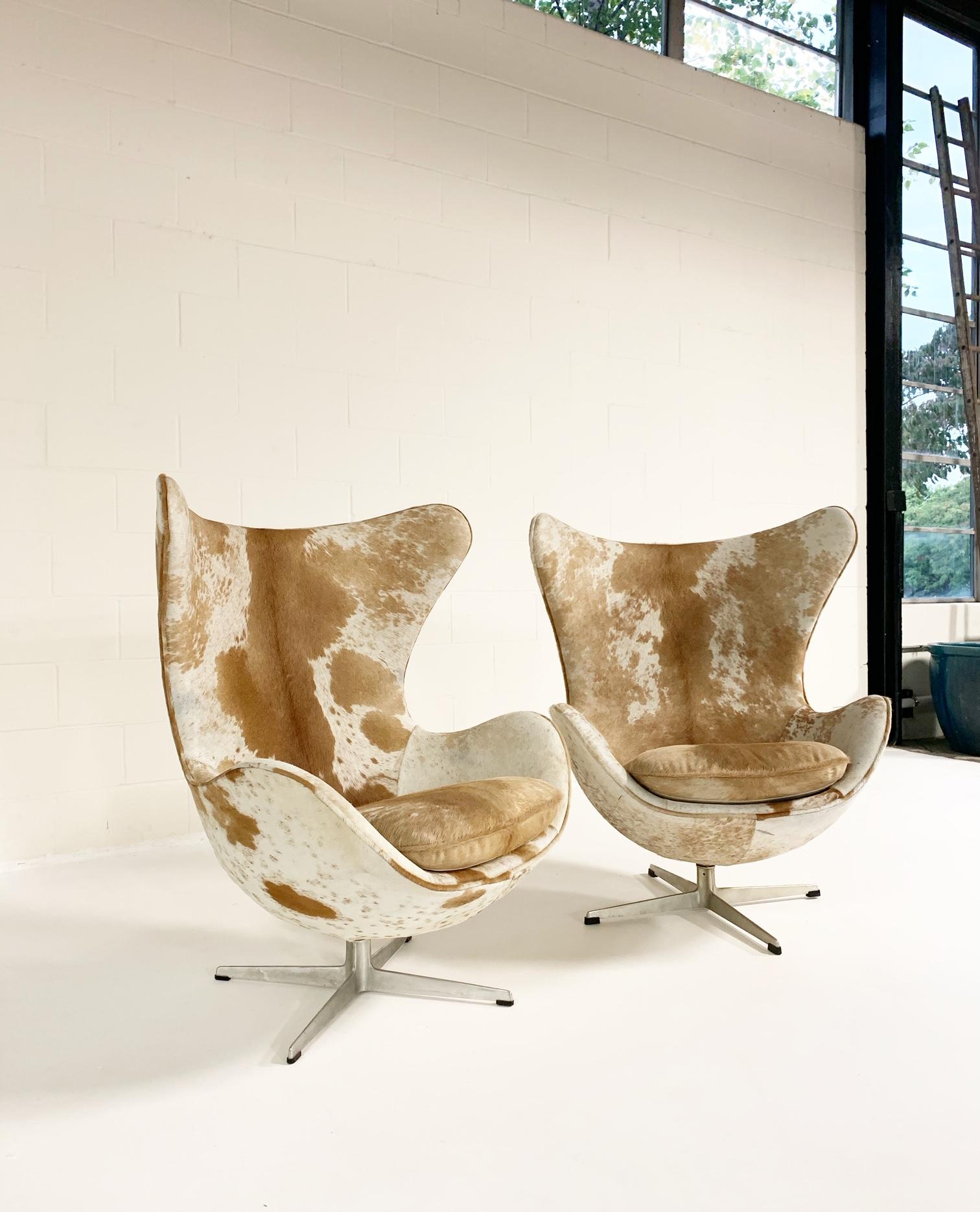 20th Century Arne Jacobsen Egg Chairs and Ottoman in Brazilian Cowhide