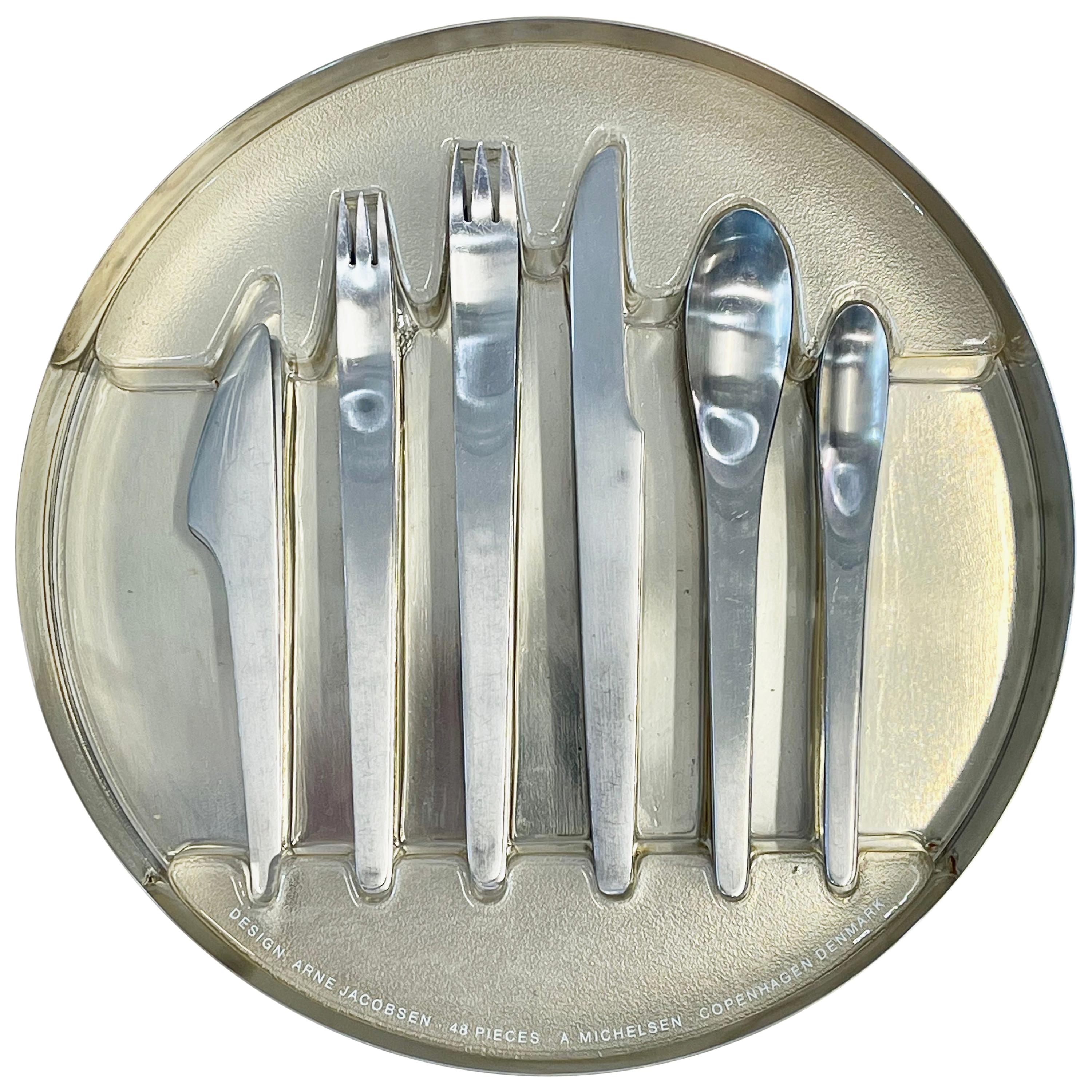 Arne Jacobsen 'AJ' six-piece flatware set for eight, 1970s. 
Stainless steel. Manufactured by A. Michelsen, by appointment to The King of Denmark , since 1957. Each piece impressed with maker's mark. 
In its original stainless steel round box with