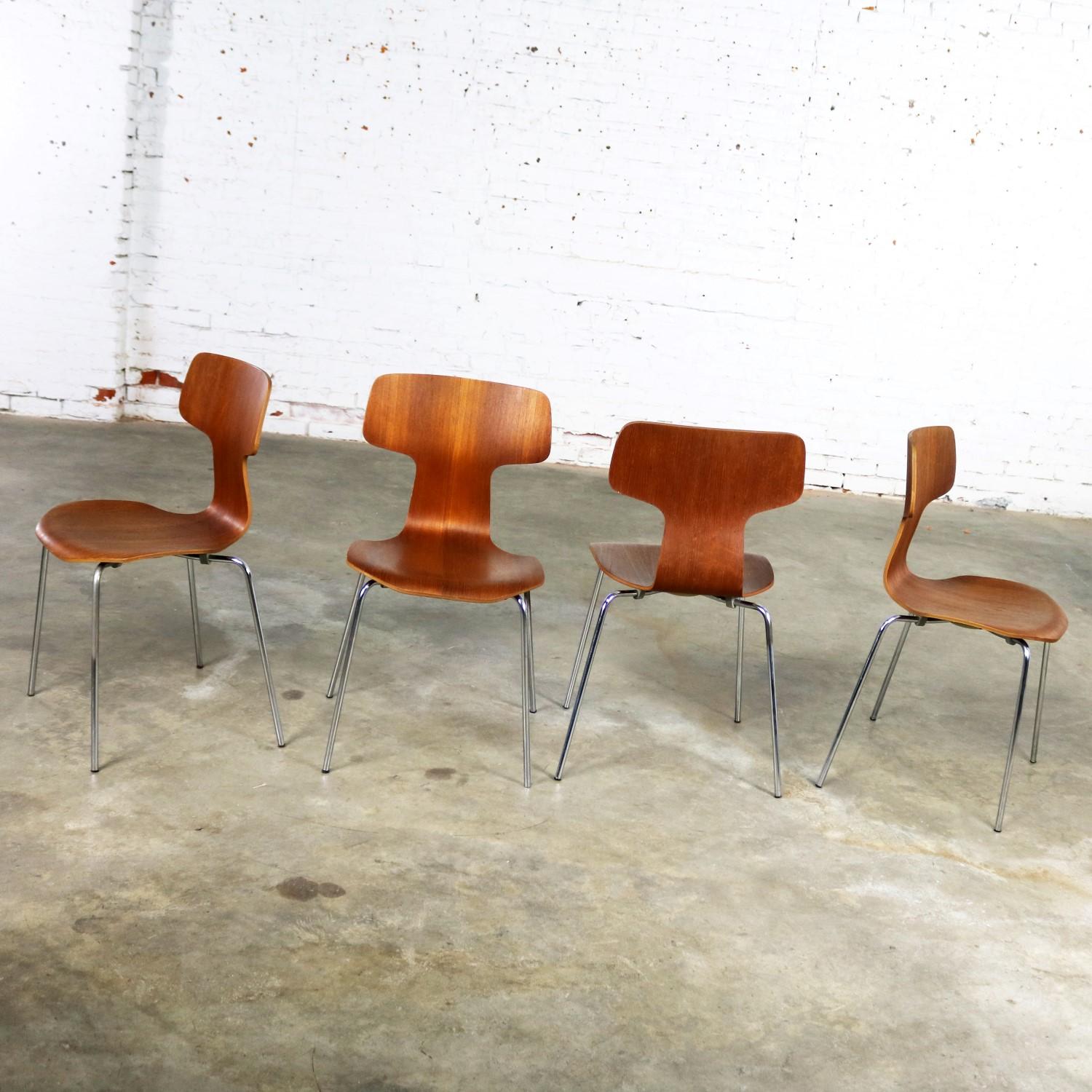 Handsome and iconic set of four model 3103 chairs by Arne Jacobsen for Fritz Hansen. Sometimes called the hammer chair or the T chair. This set is in amazing original vintage condition with normal wear and no outstanding flaws. Their teak is